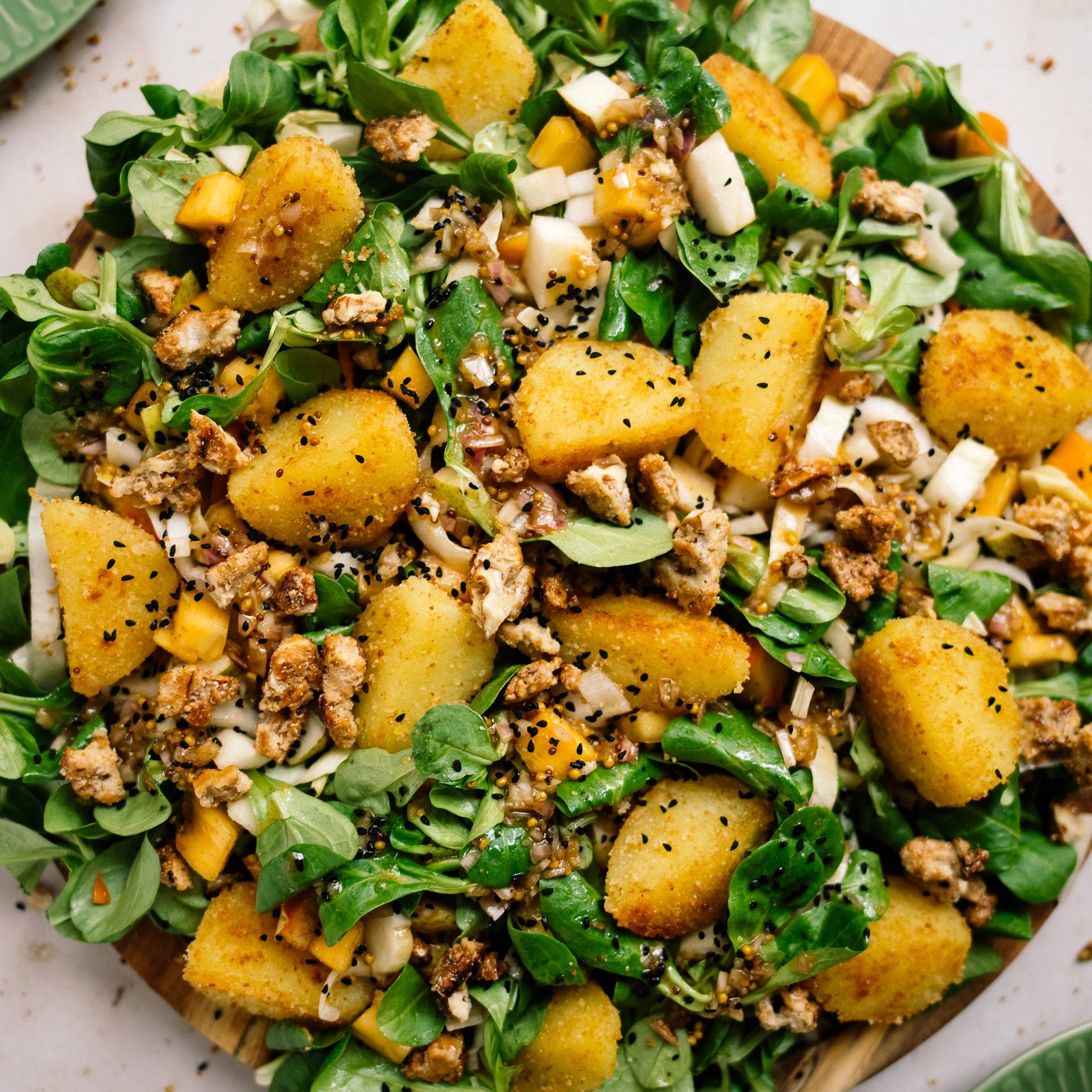 Chicory and Lamb's Lettuce Salad with Pear, Persimmon, and Dumpling Croutons