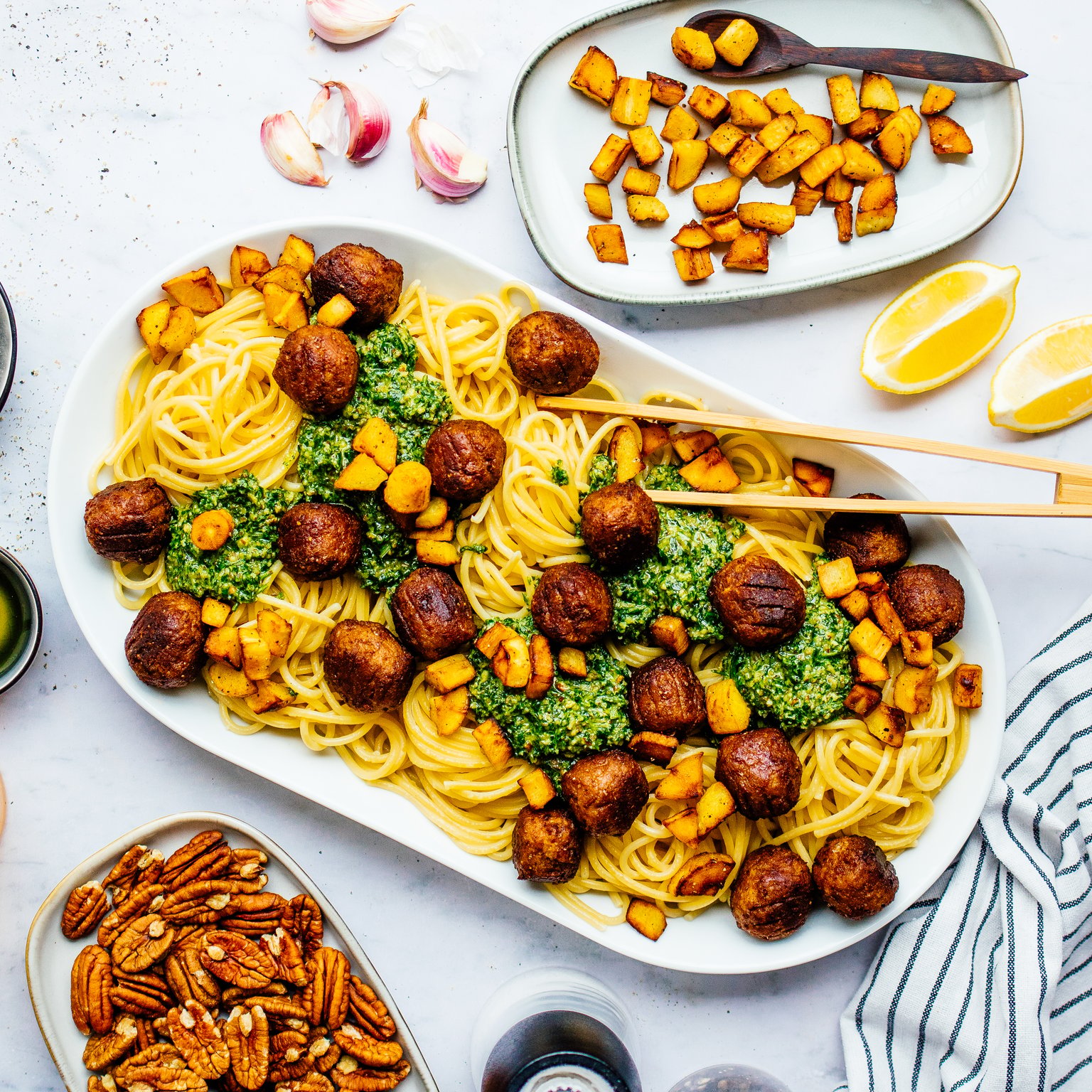 Arugula Pesto Pasta with Plant-based Meatballs and Crispy Parsnip