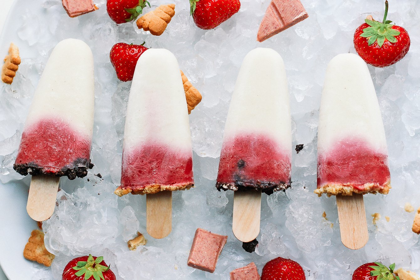4 popsicle strawberry cheesecake in a row on crushed ice