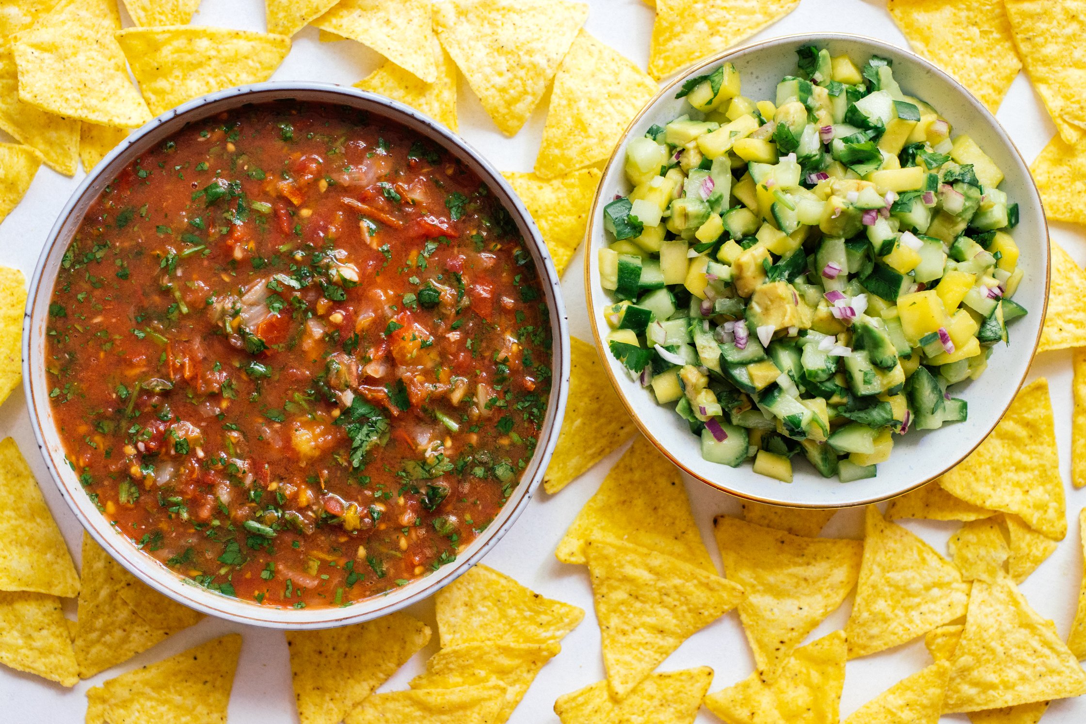 vegan tomato salsa and mango salsa in bowls