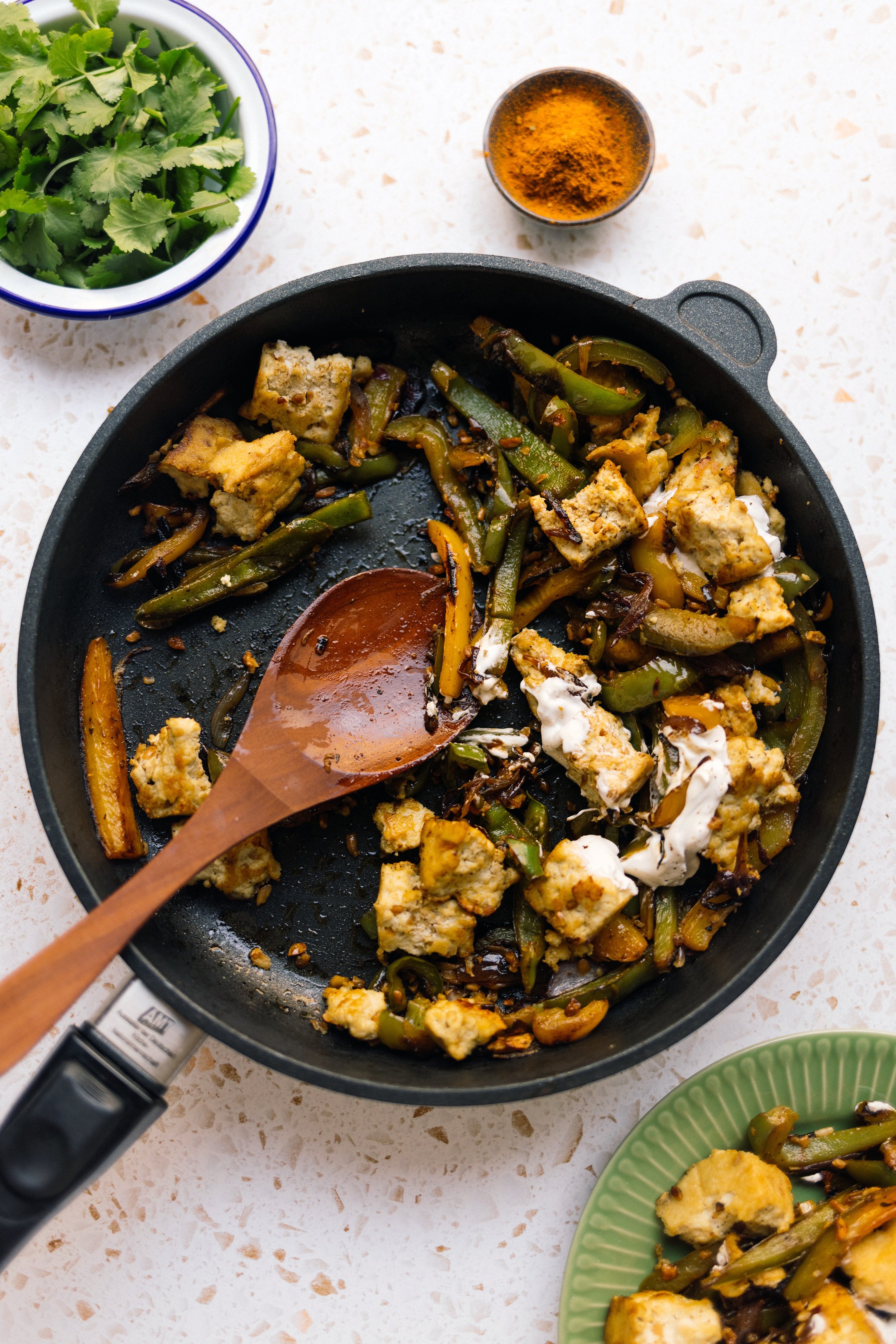 half-full frying pan of tofu fajitas