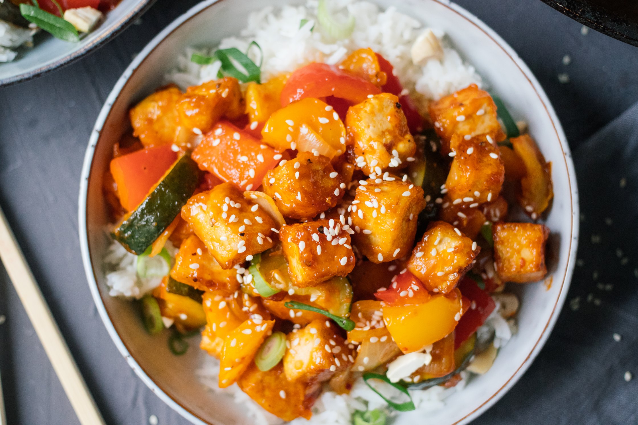 close up of sweet and sour tofu with rice
