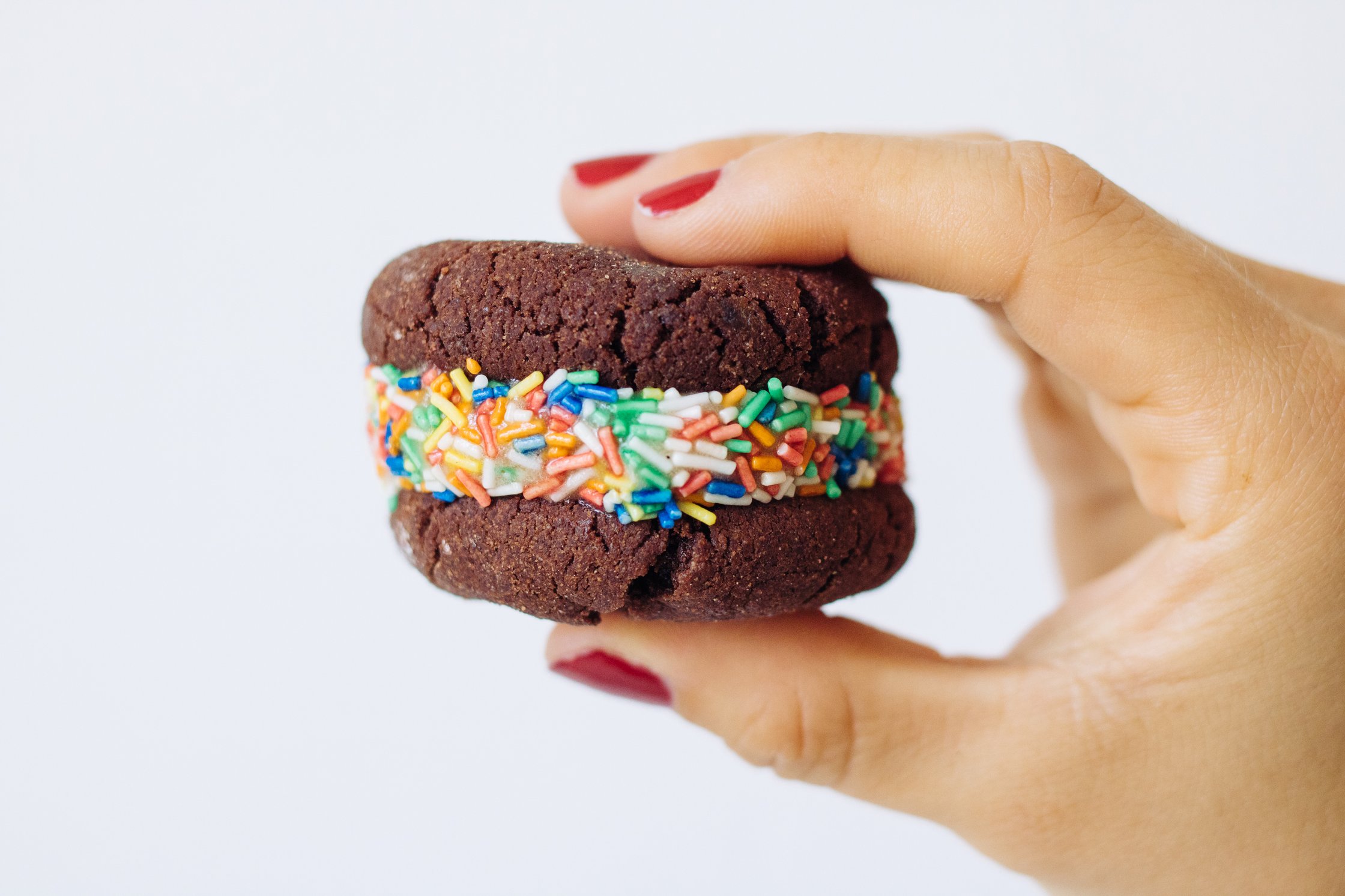 a hand holding a single Vegan Nicecream Sandwich