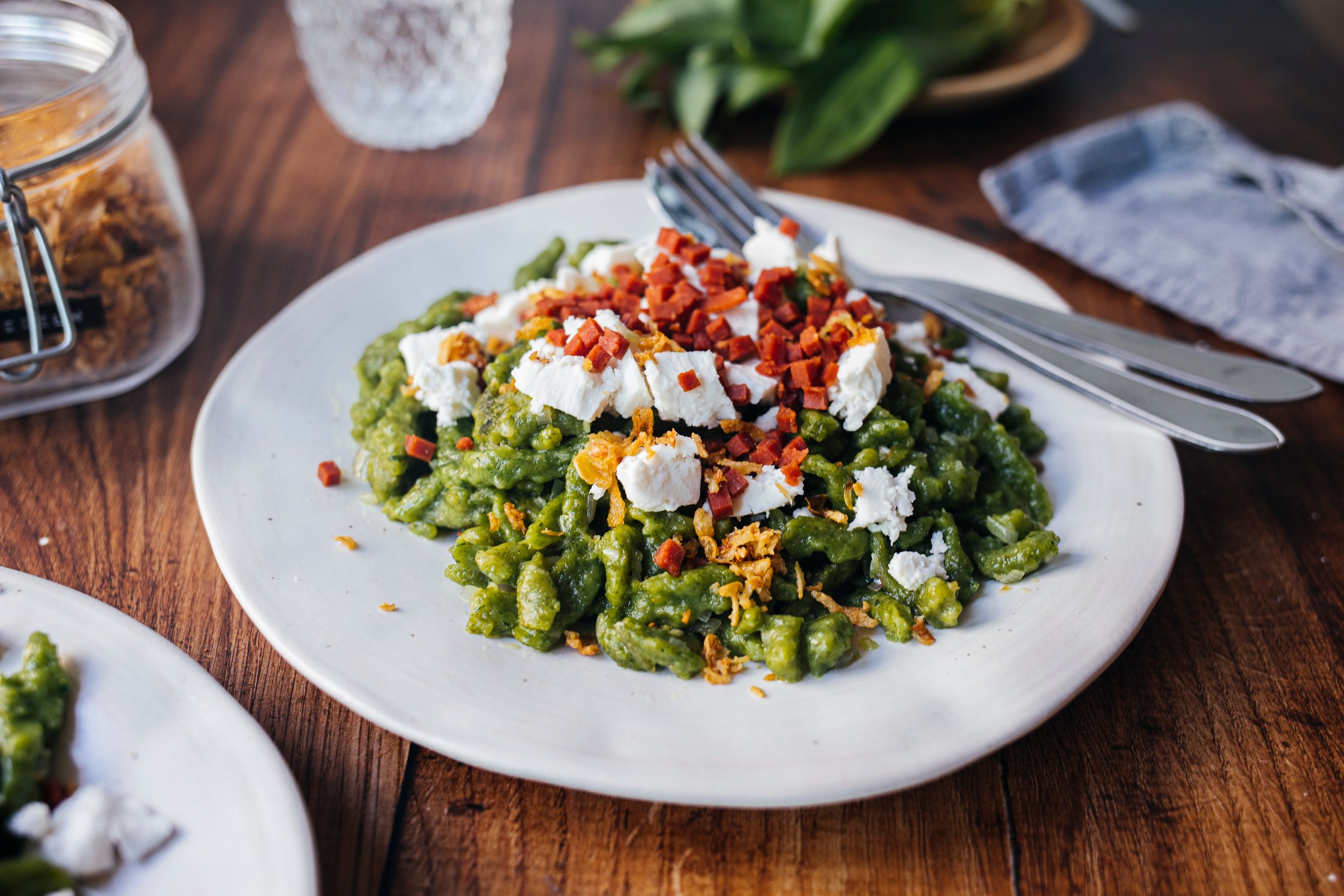 vegan wild garlic spaetzle pasta with fried onions and feta cheese