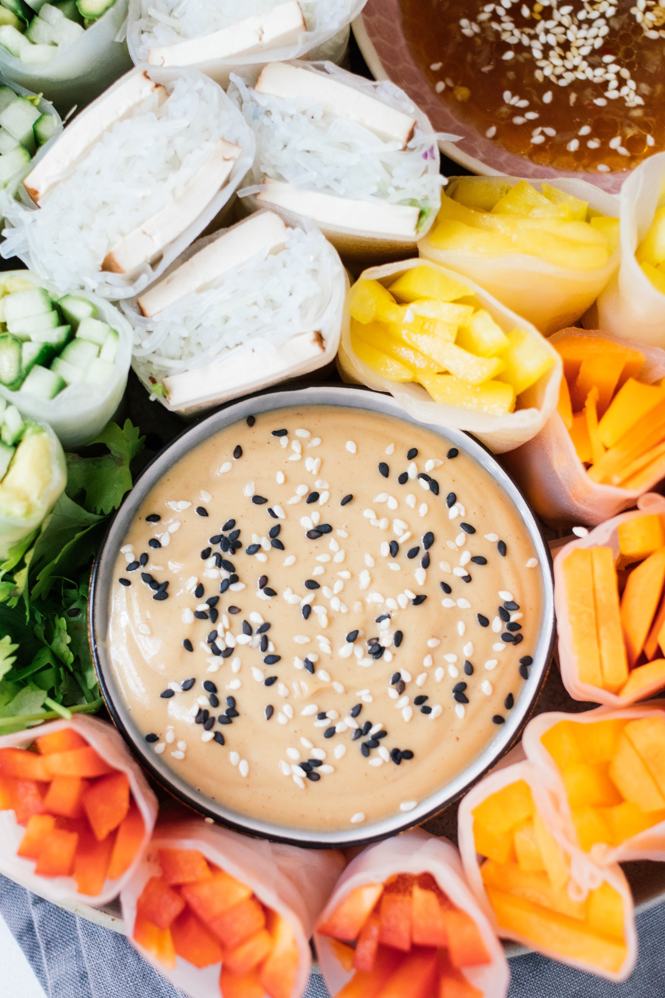 halved vegan summer rolls on a plate