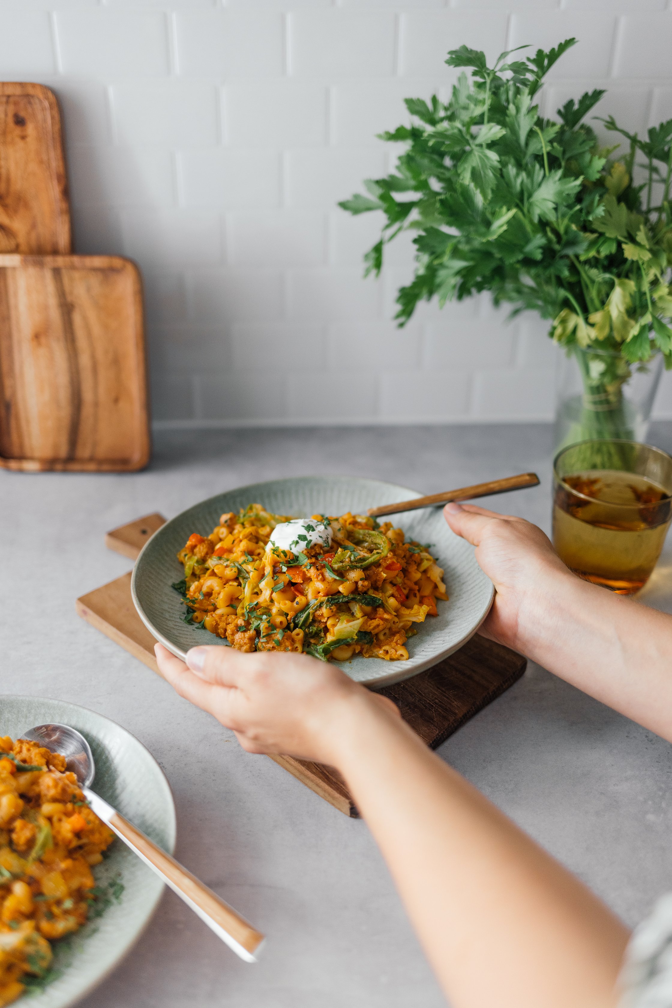 serving vegan one pot pasta with savoy cabbage