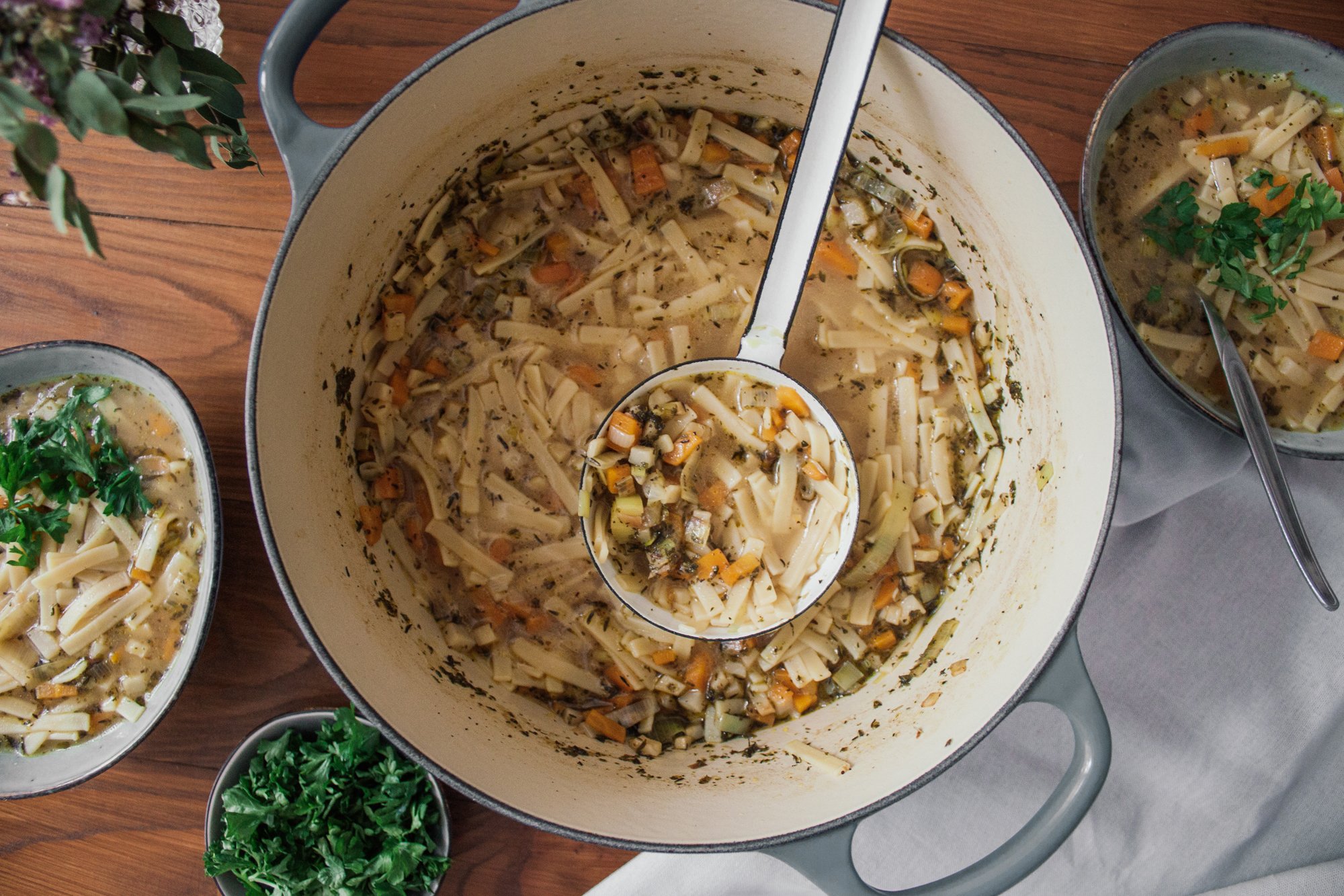 vegan noodle soup is served on the table