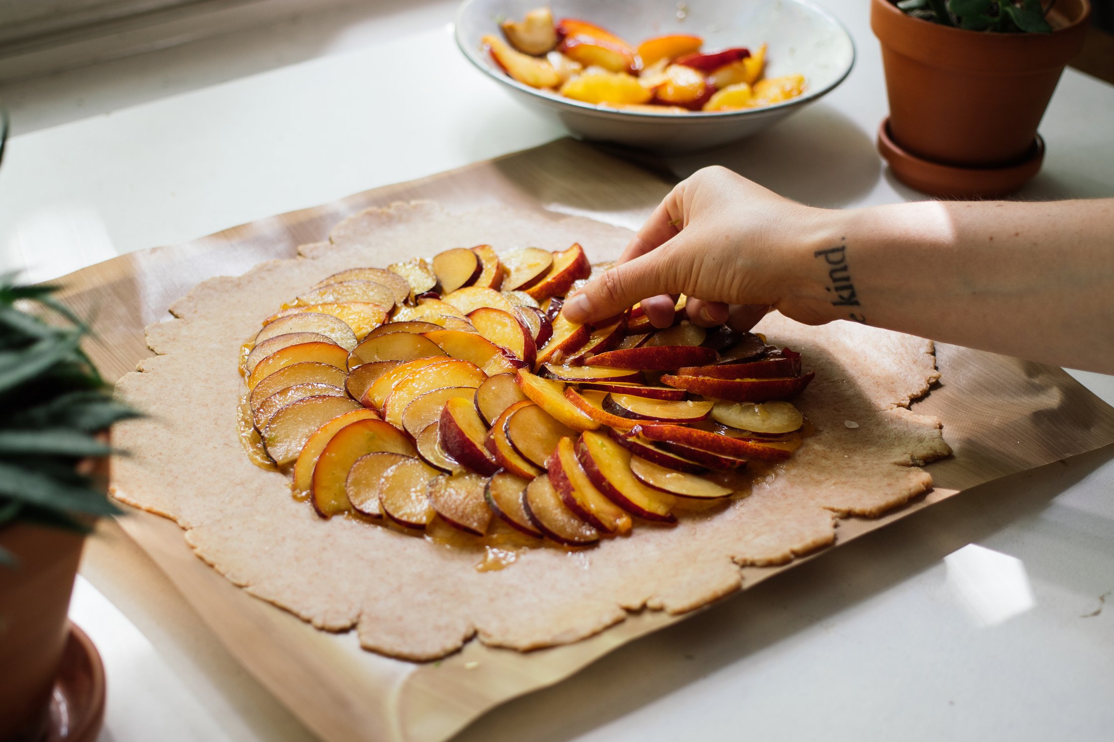 adding fruits on top of vegan galette