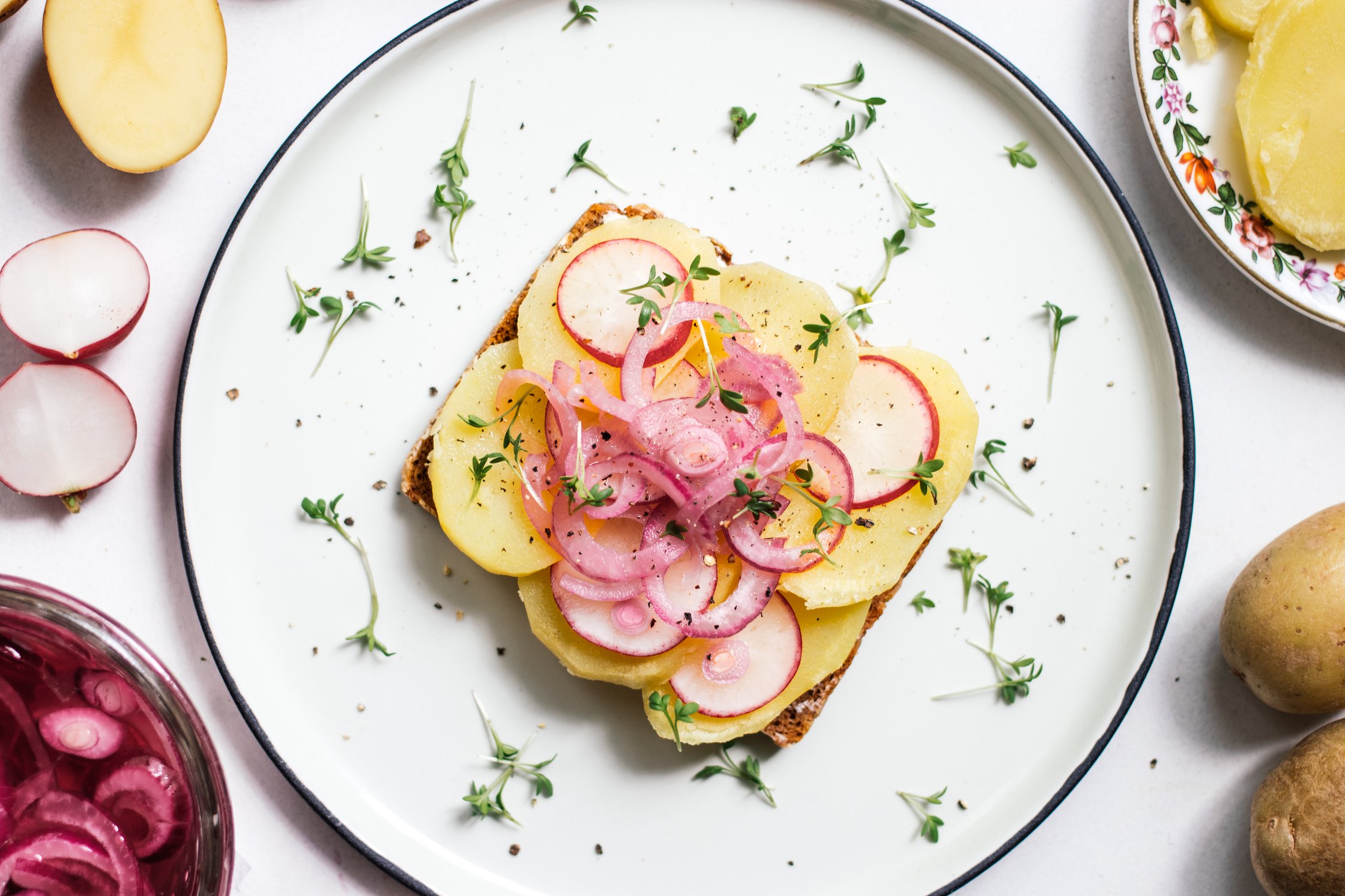 vegan smorrebrod with potatoes and pickled onions