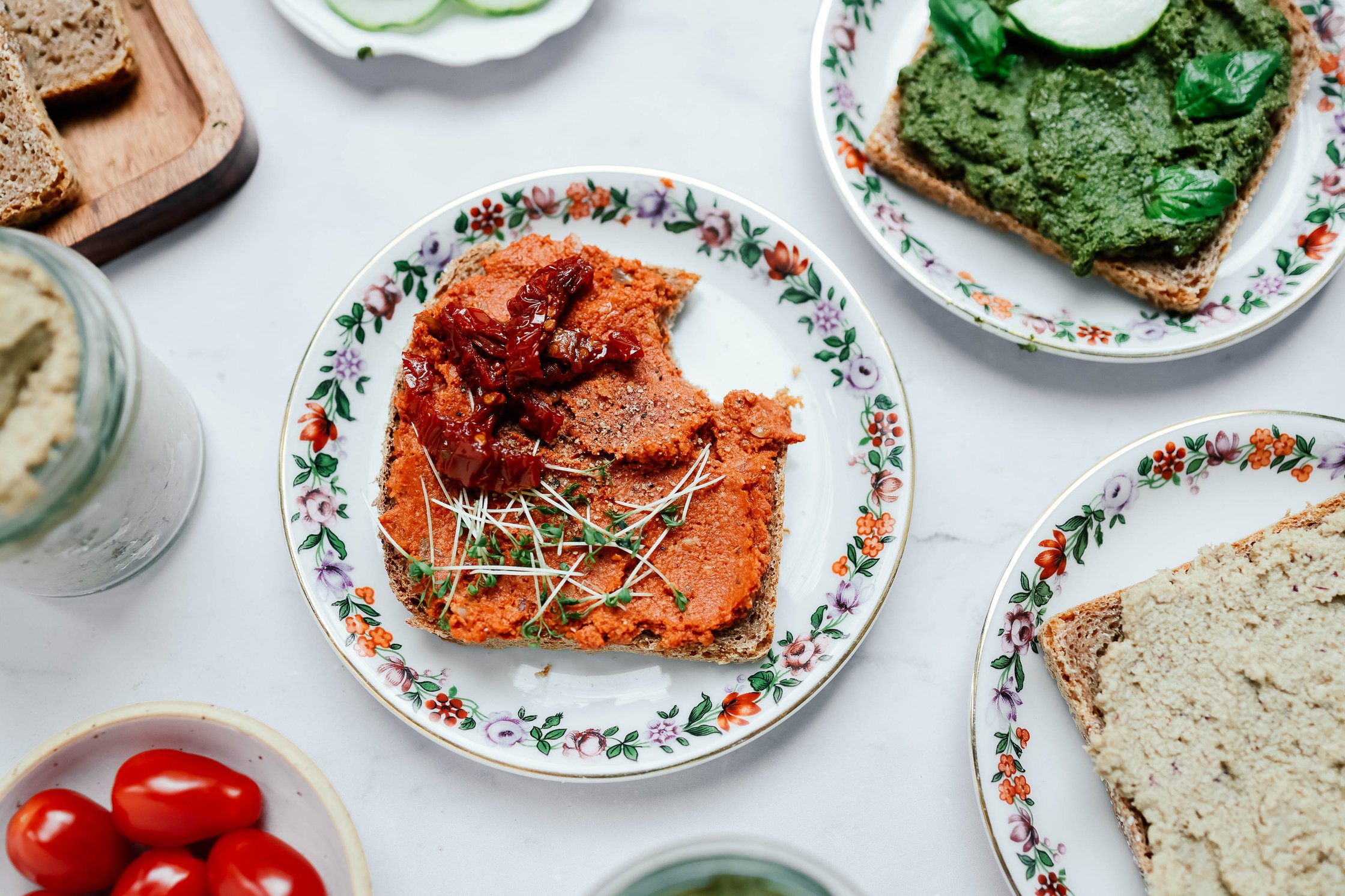 different vegan spreads on slices of bread