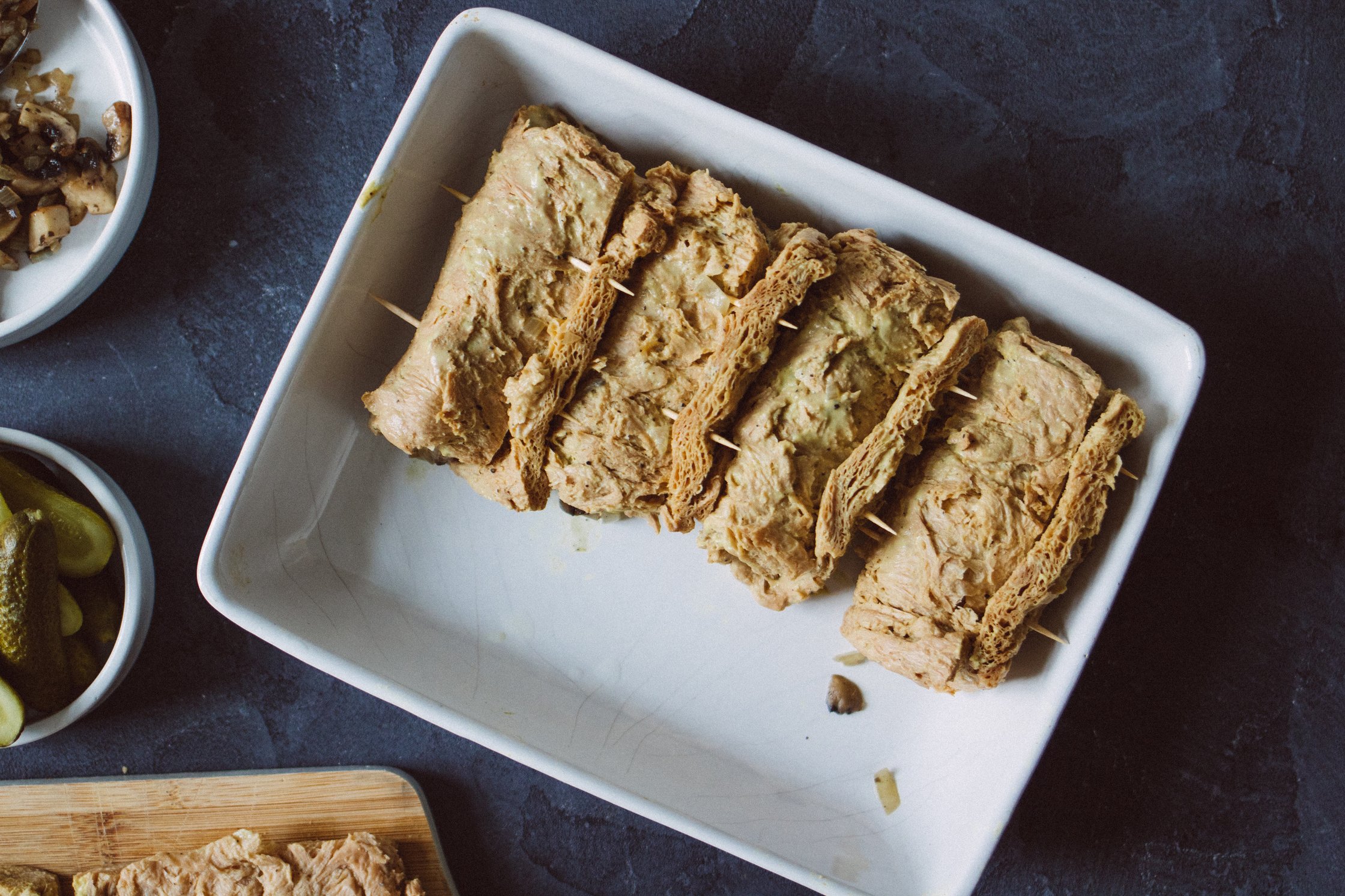 rolled stuffed soy steak in casserole dish