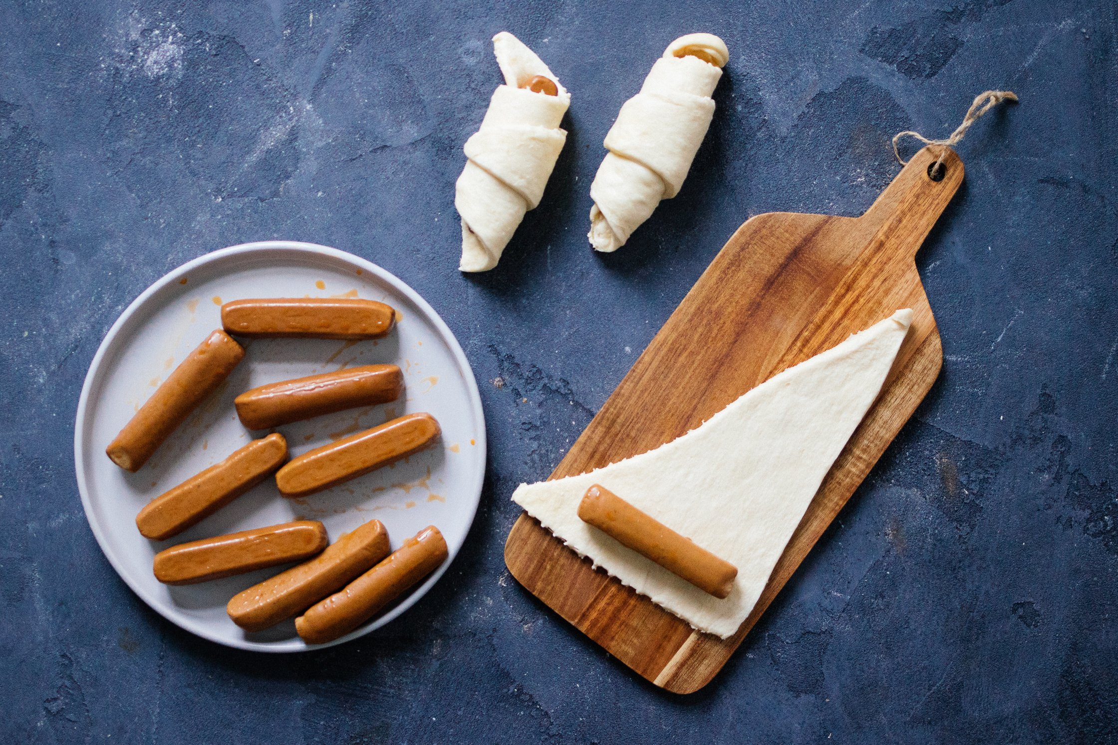 wrapping the sausages in the dough