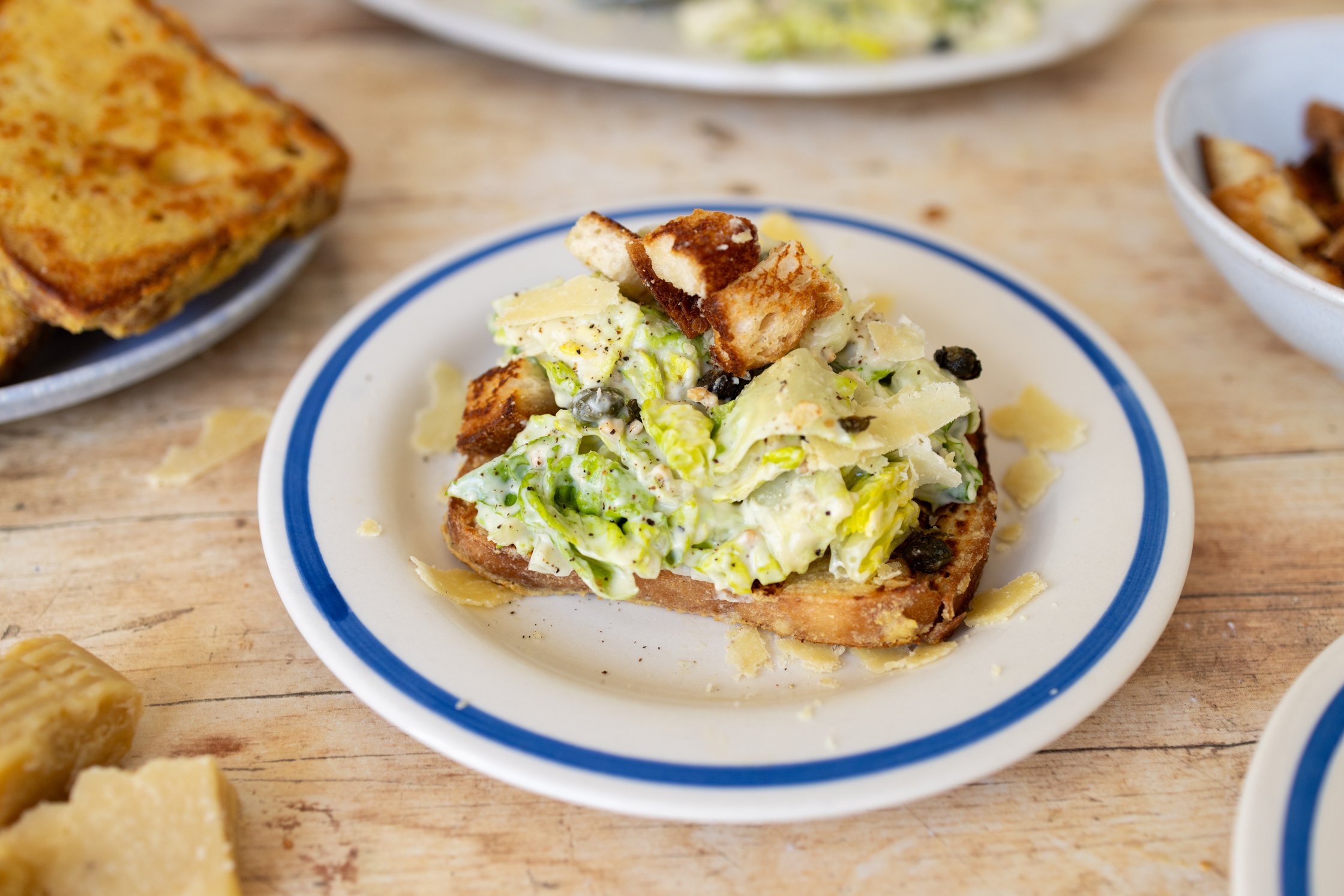 Savory French Toast with Vegan Caesar Salad is served on the table