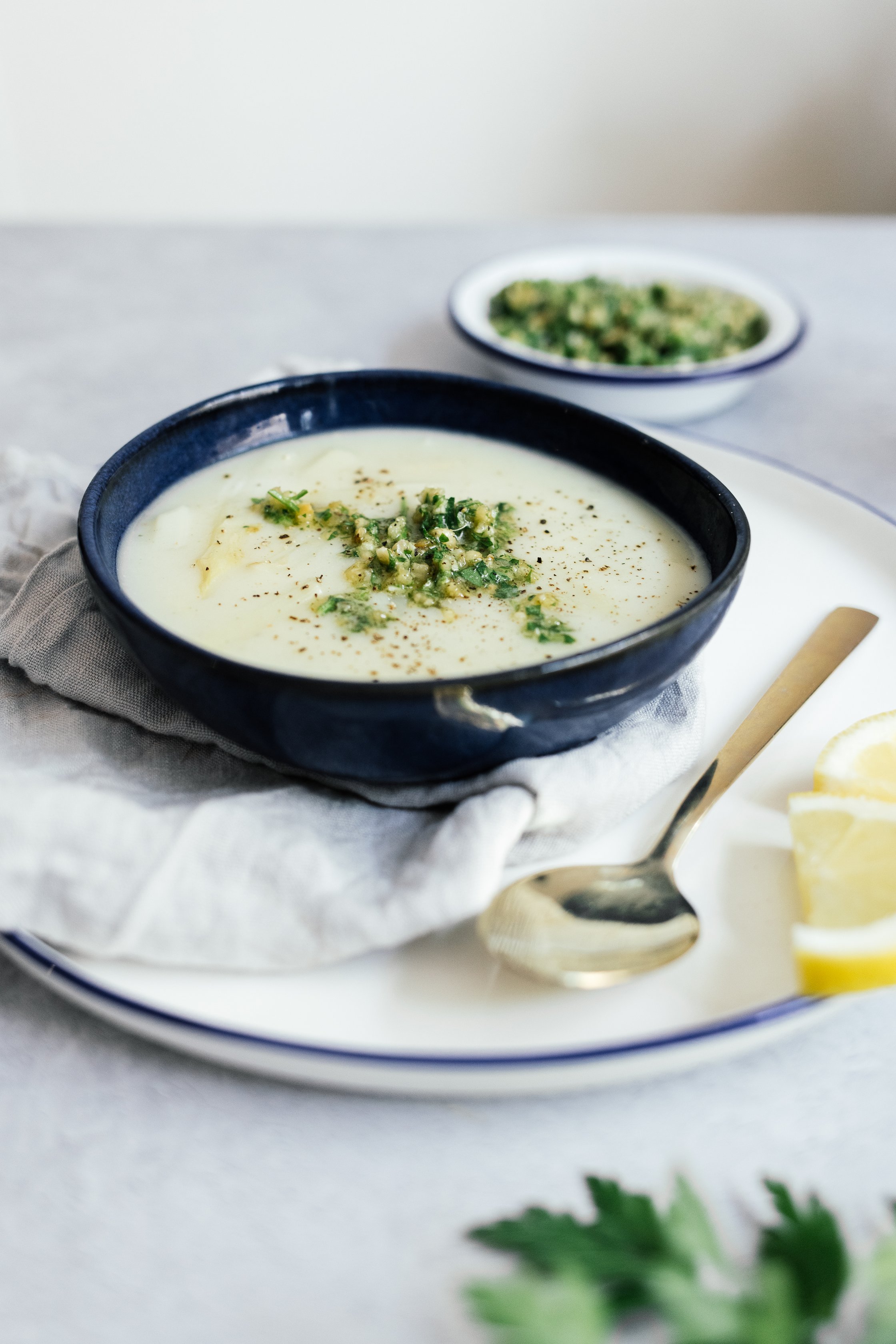ready made vegan asparagus soup with hazelnut parsley topping
