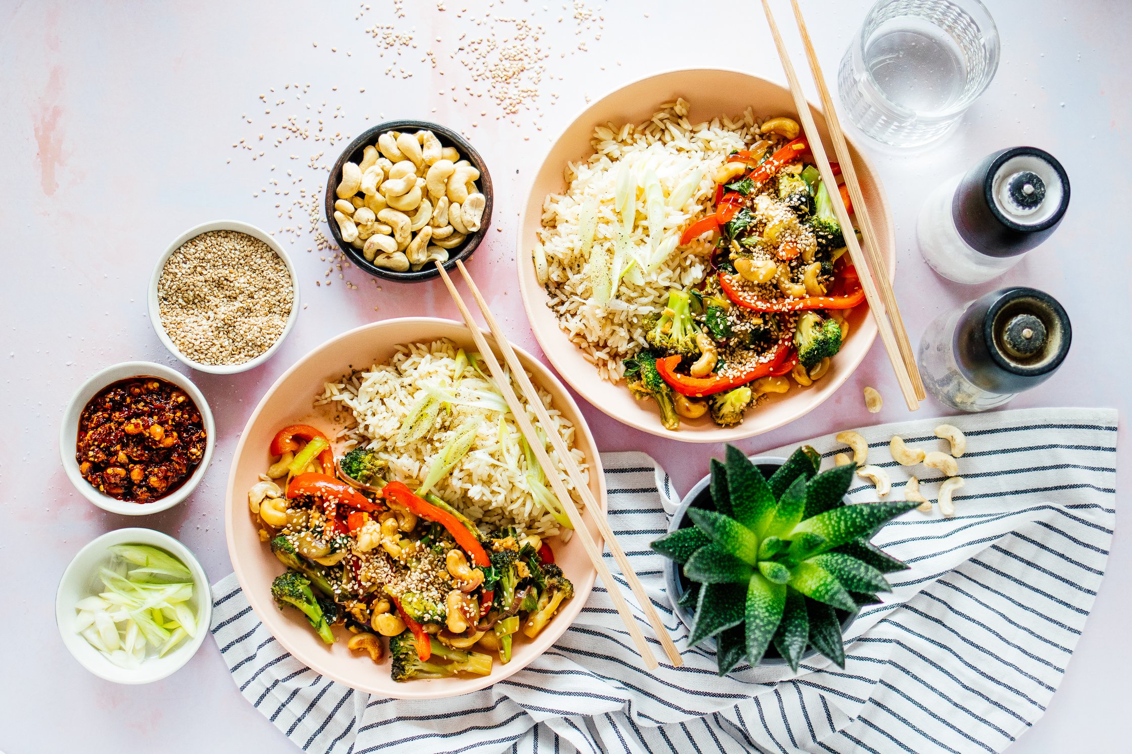 two bowls with rice and veggies