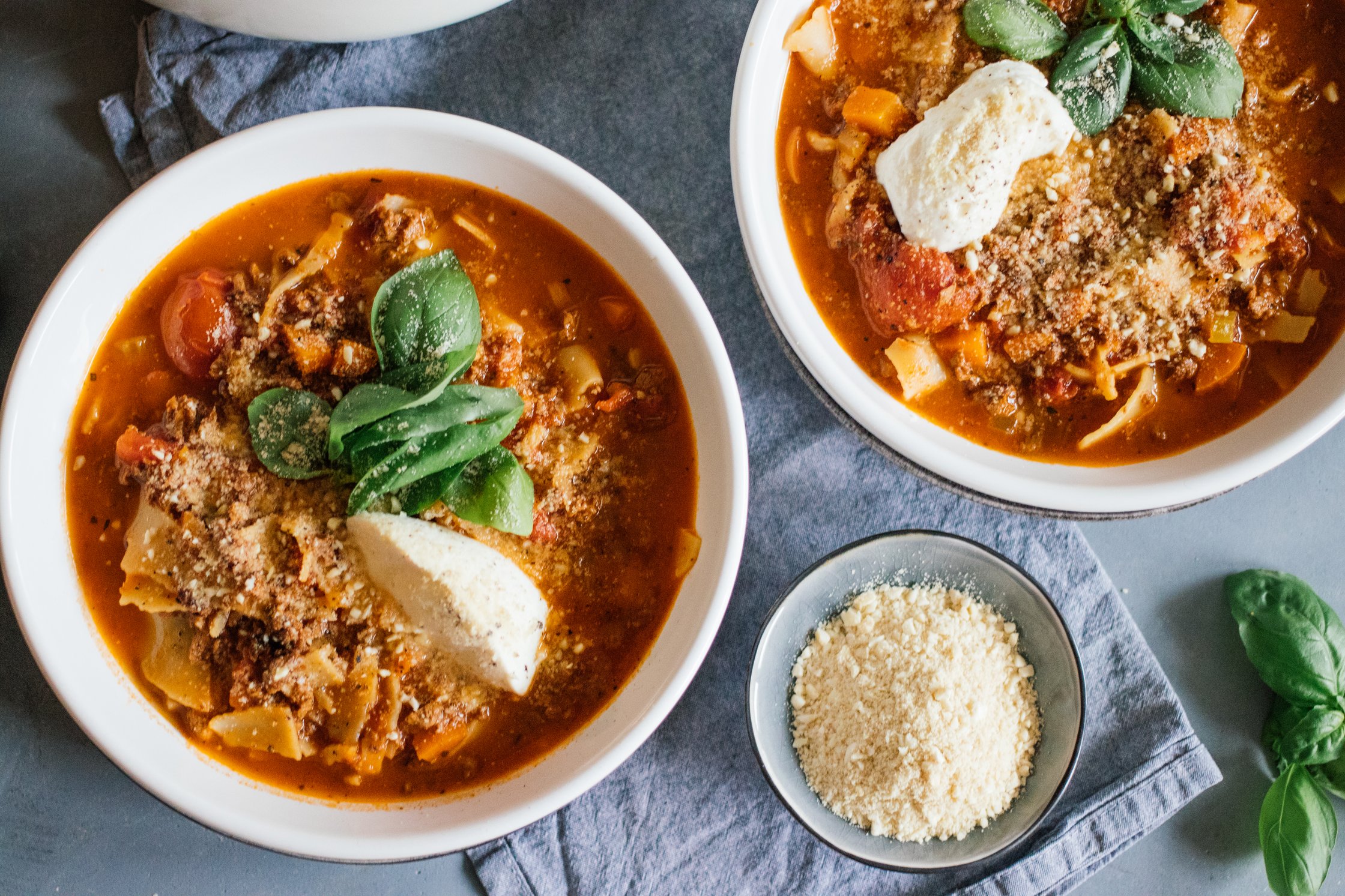 two bowls of vegan lasagna soup