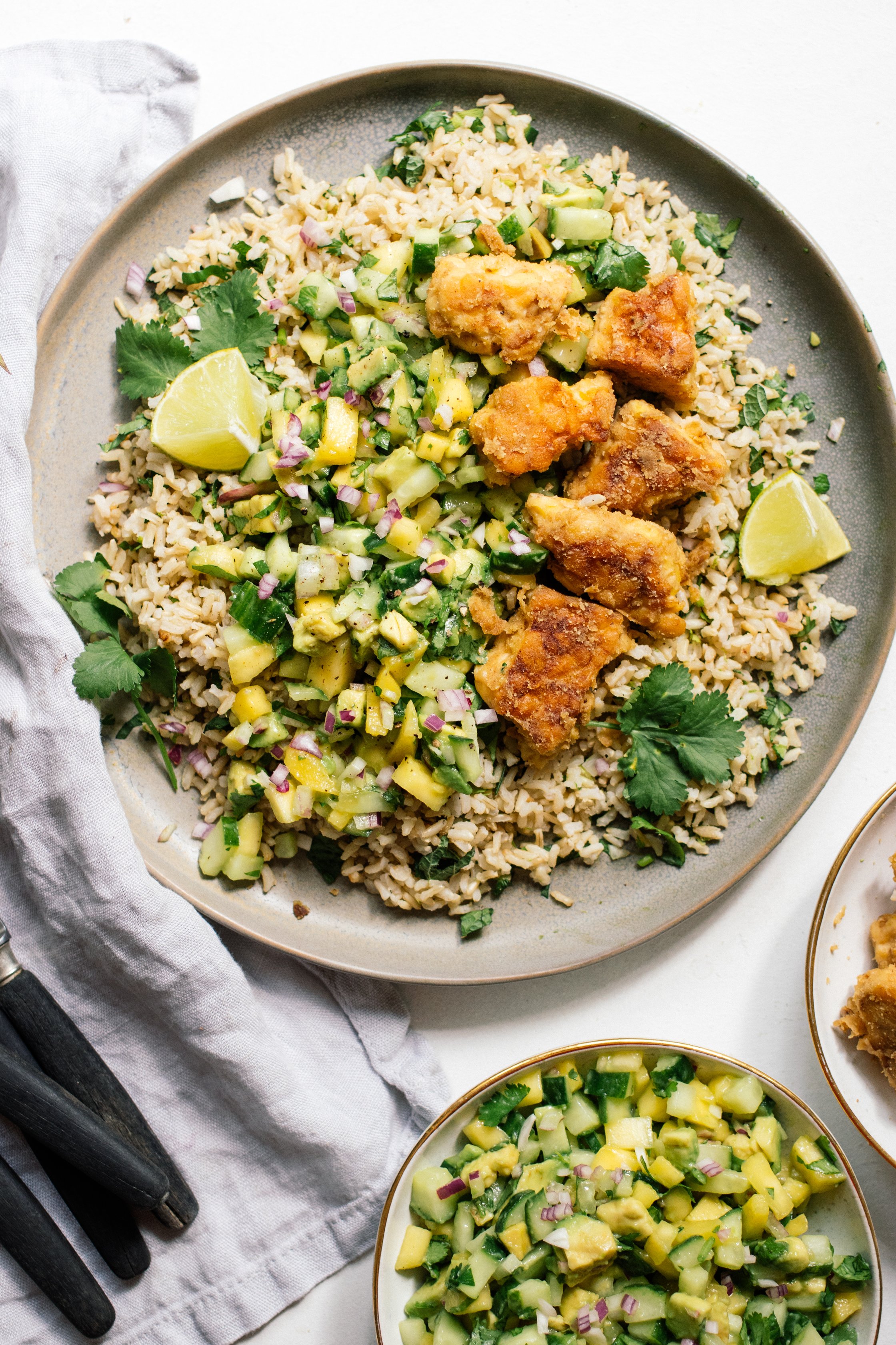Lime rice with tempeh and mango avocado salsa on the table