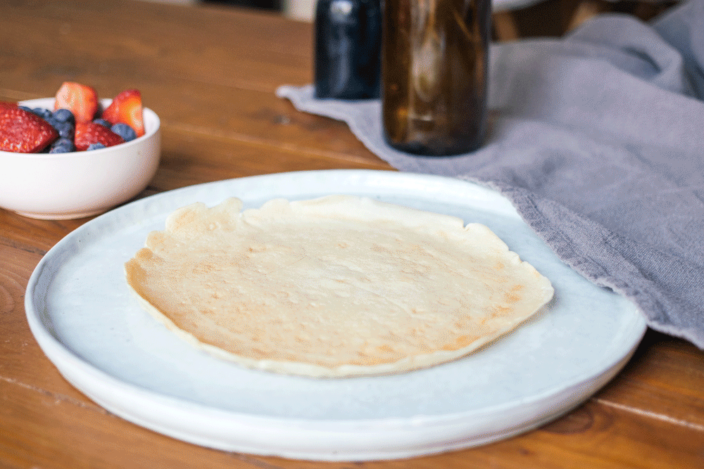 Vegan crêpe cake with strawberries gets layered