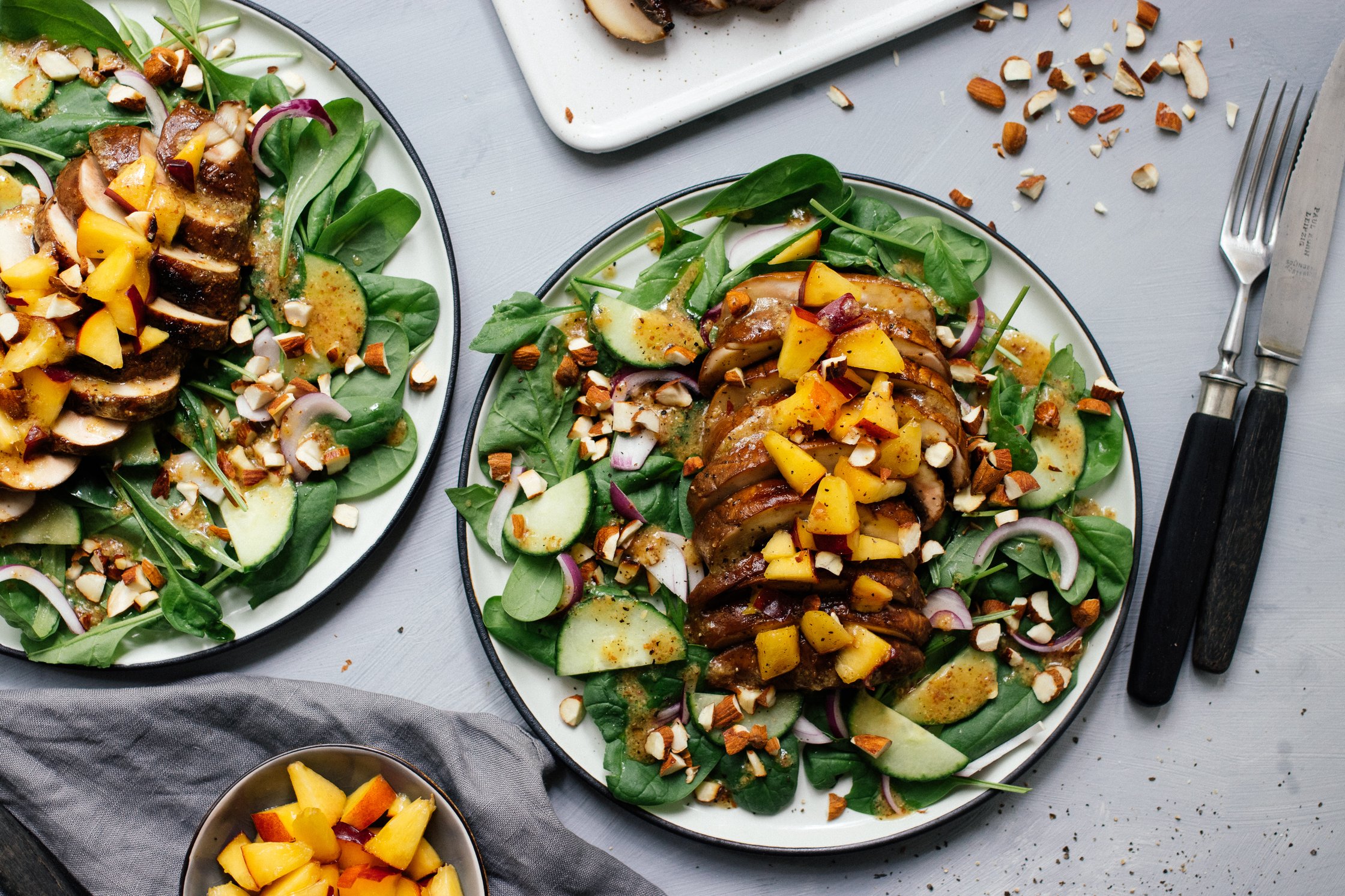 two plates with salad