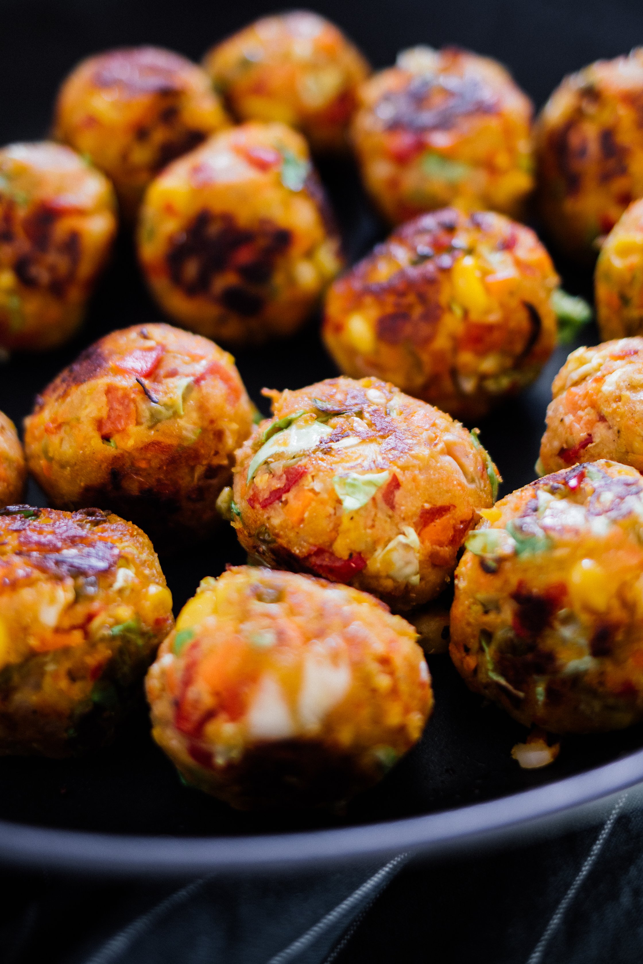 frying vegan meat balls in a pan