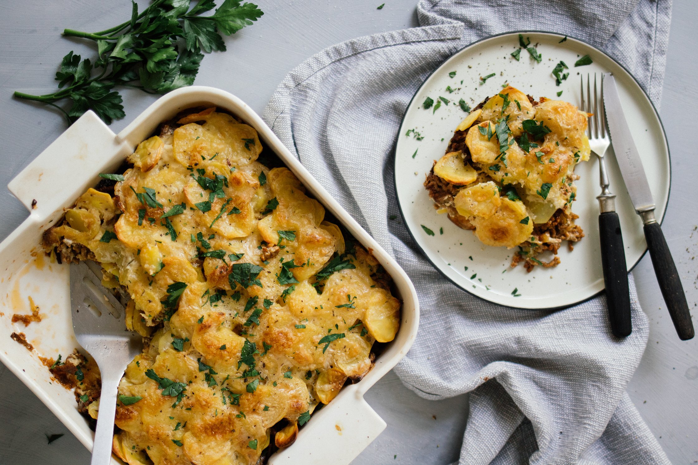 vegan potato casserole with minded meat and cream sauce