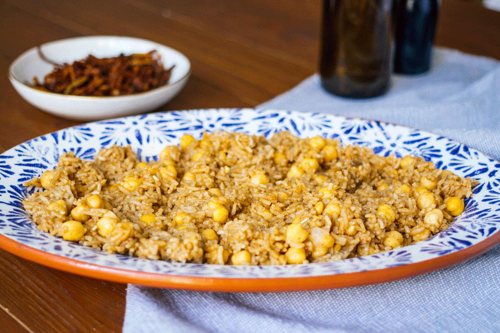 ingredients for vegan kushari get layered on a plate