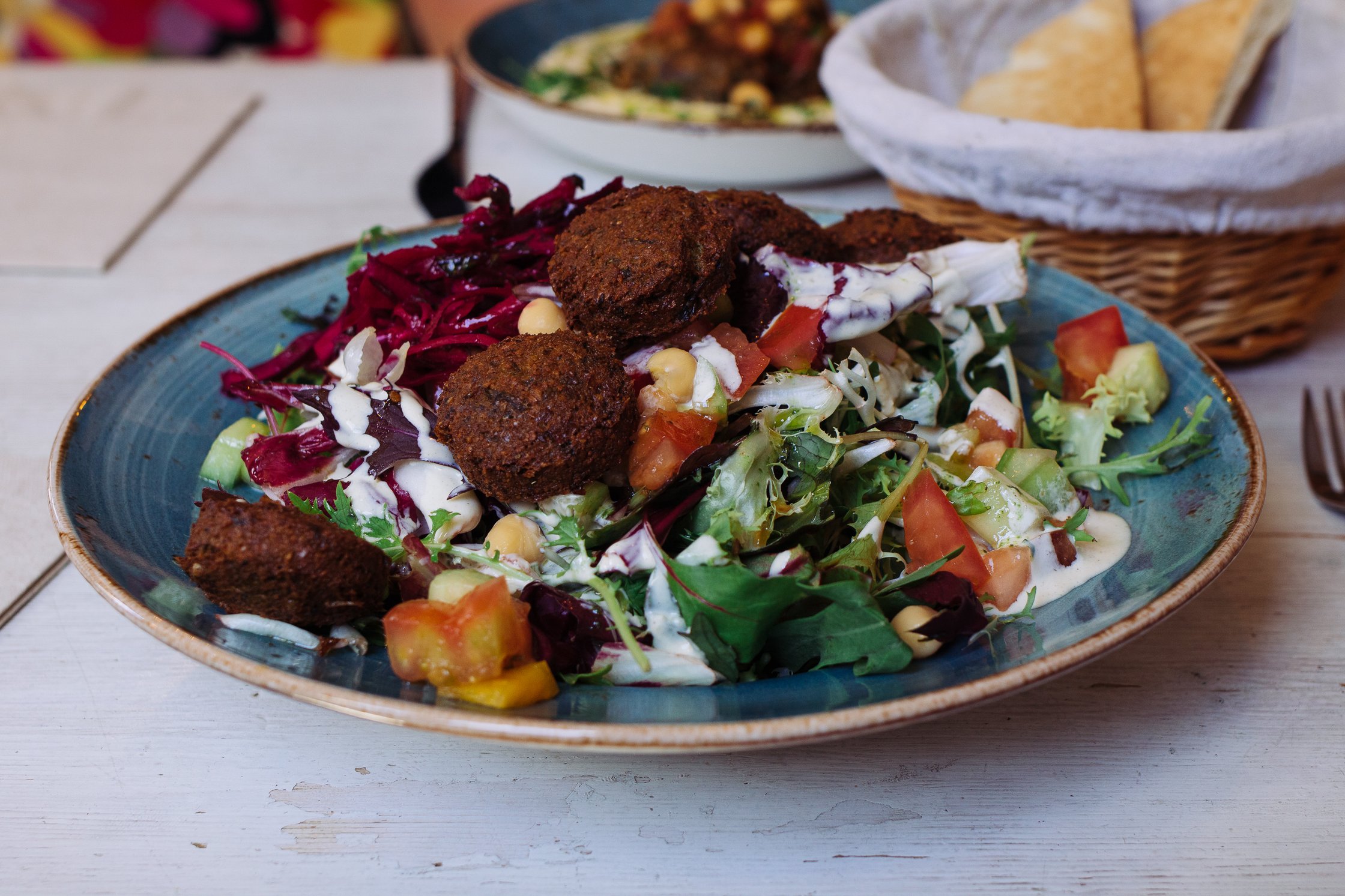 a plate with falafel and salad