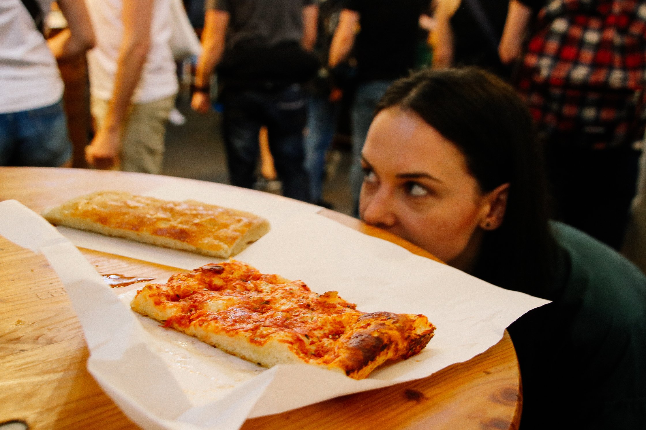 two pieces of foccachia laying on the table