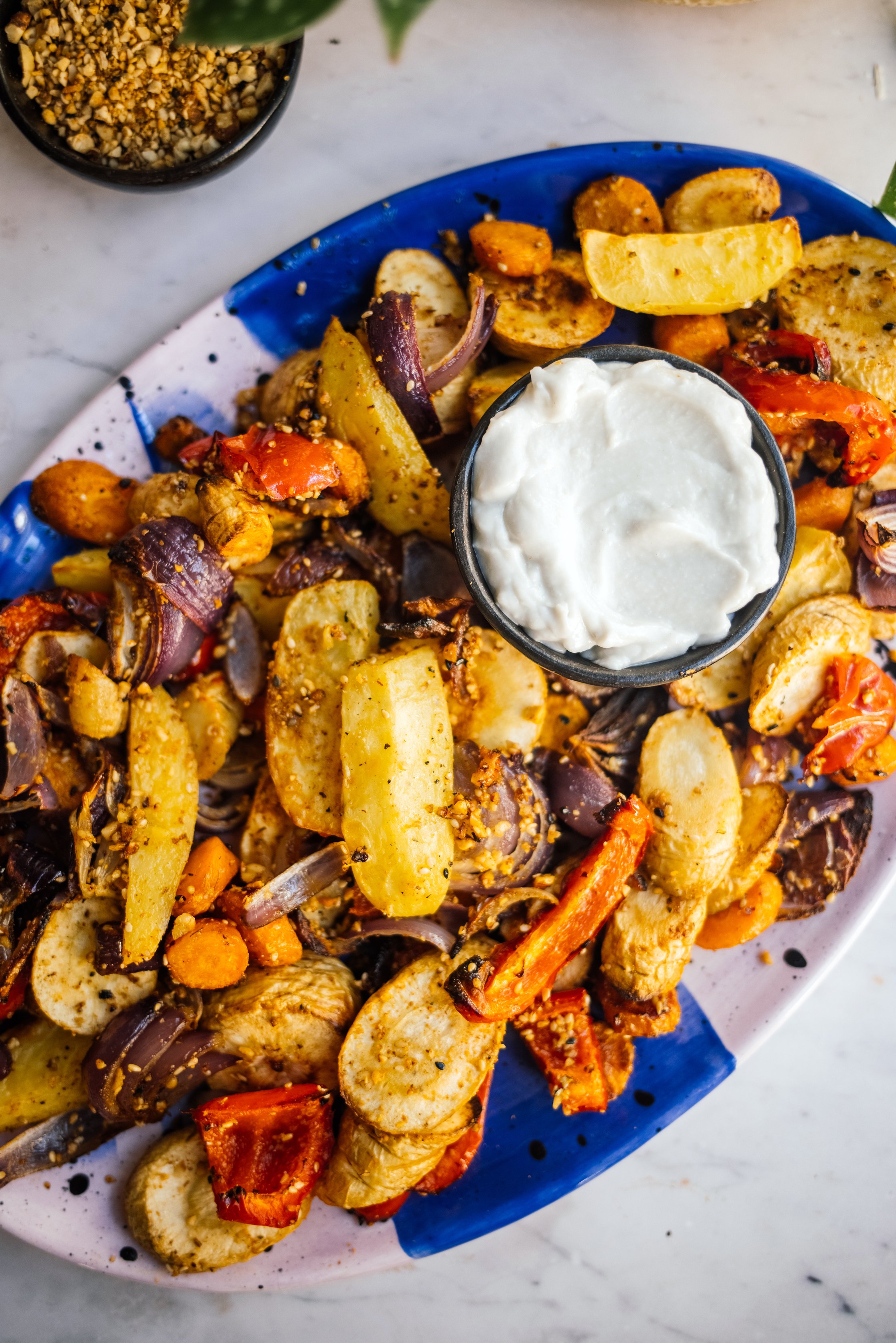 Baked Vegetables with Dukkah and Toum ready to be served