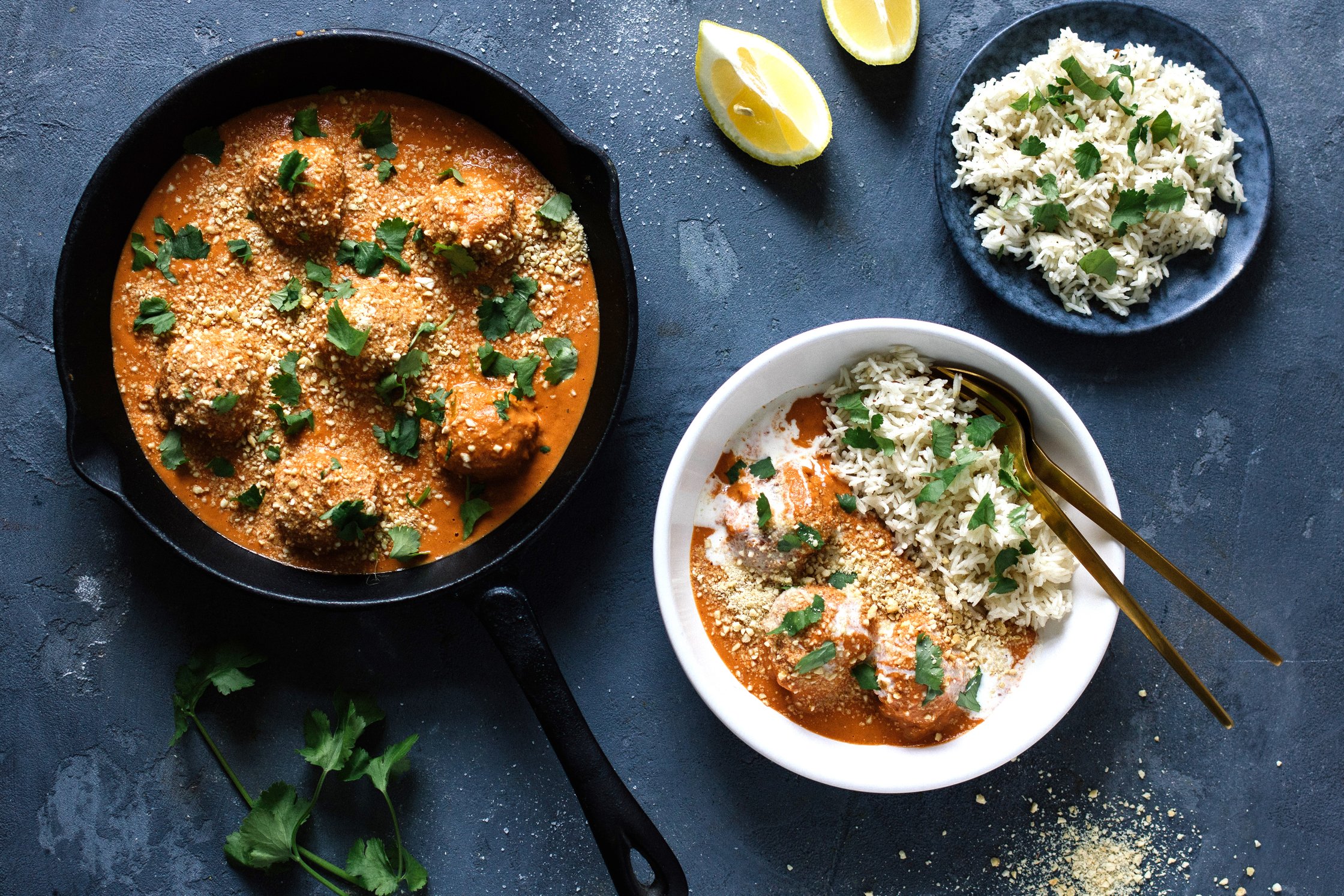 malai kofta gets served on a blue background
