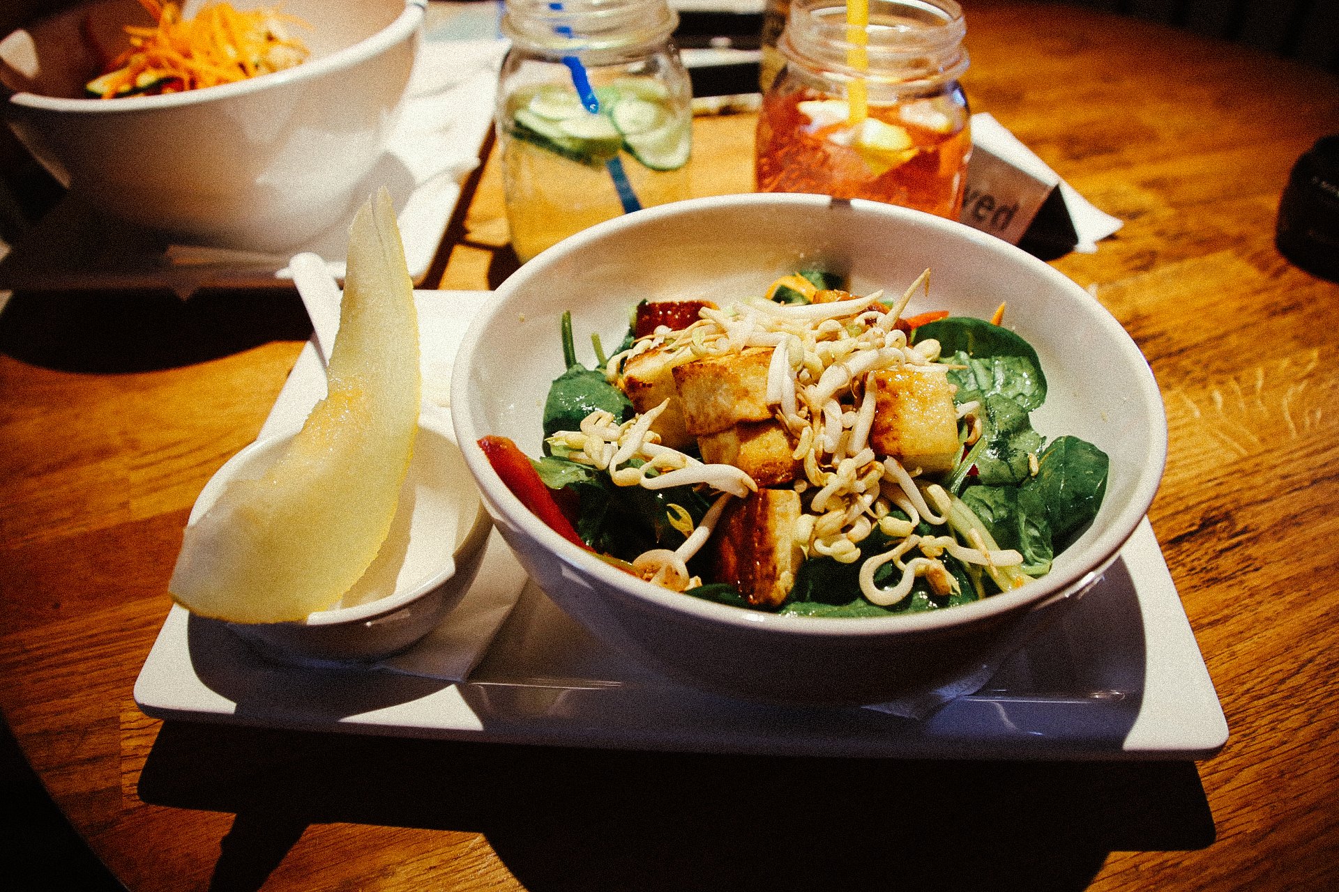 a bowl with salad and tofu