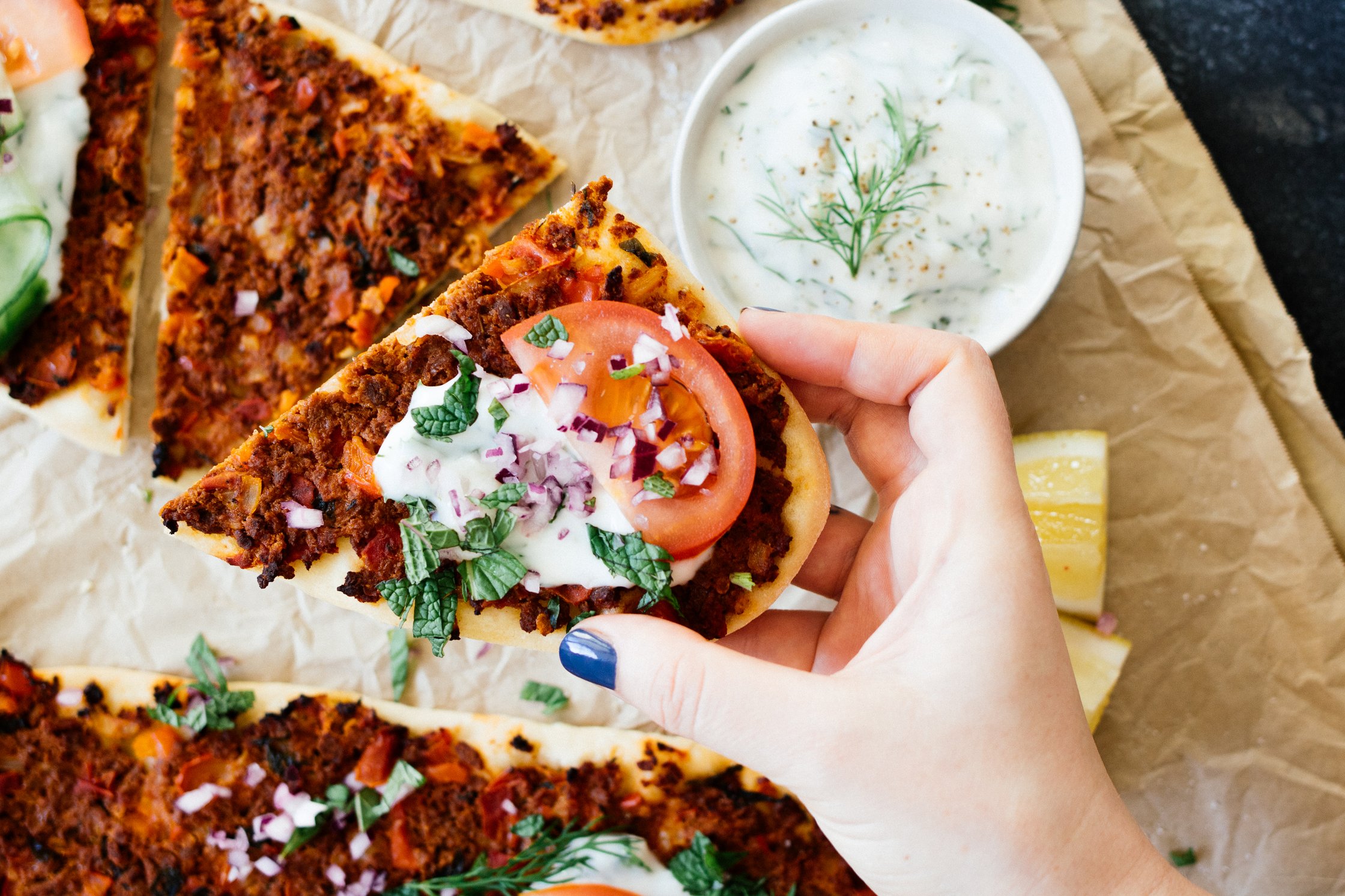 vegan Turkish pizza with onions, tomatoes and herbs