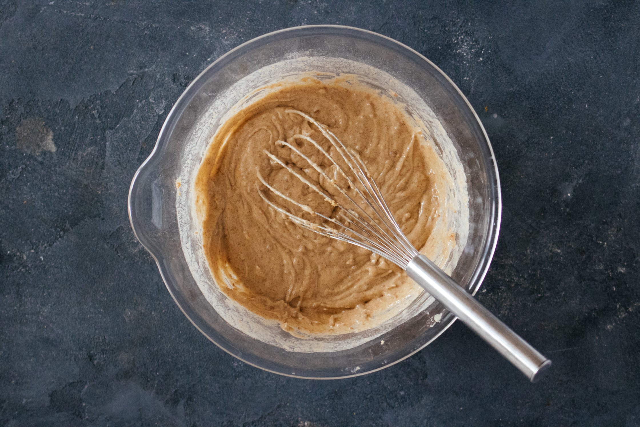 making the cake dough in a glass bowl