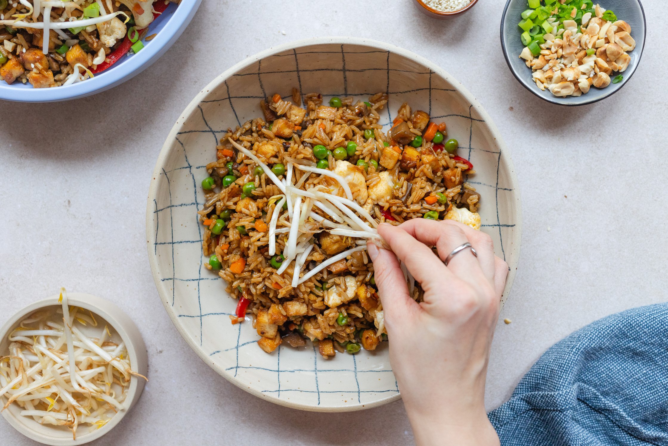a plate of vegan stir fry is served with sprouts