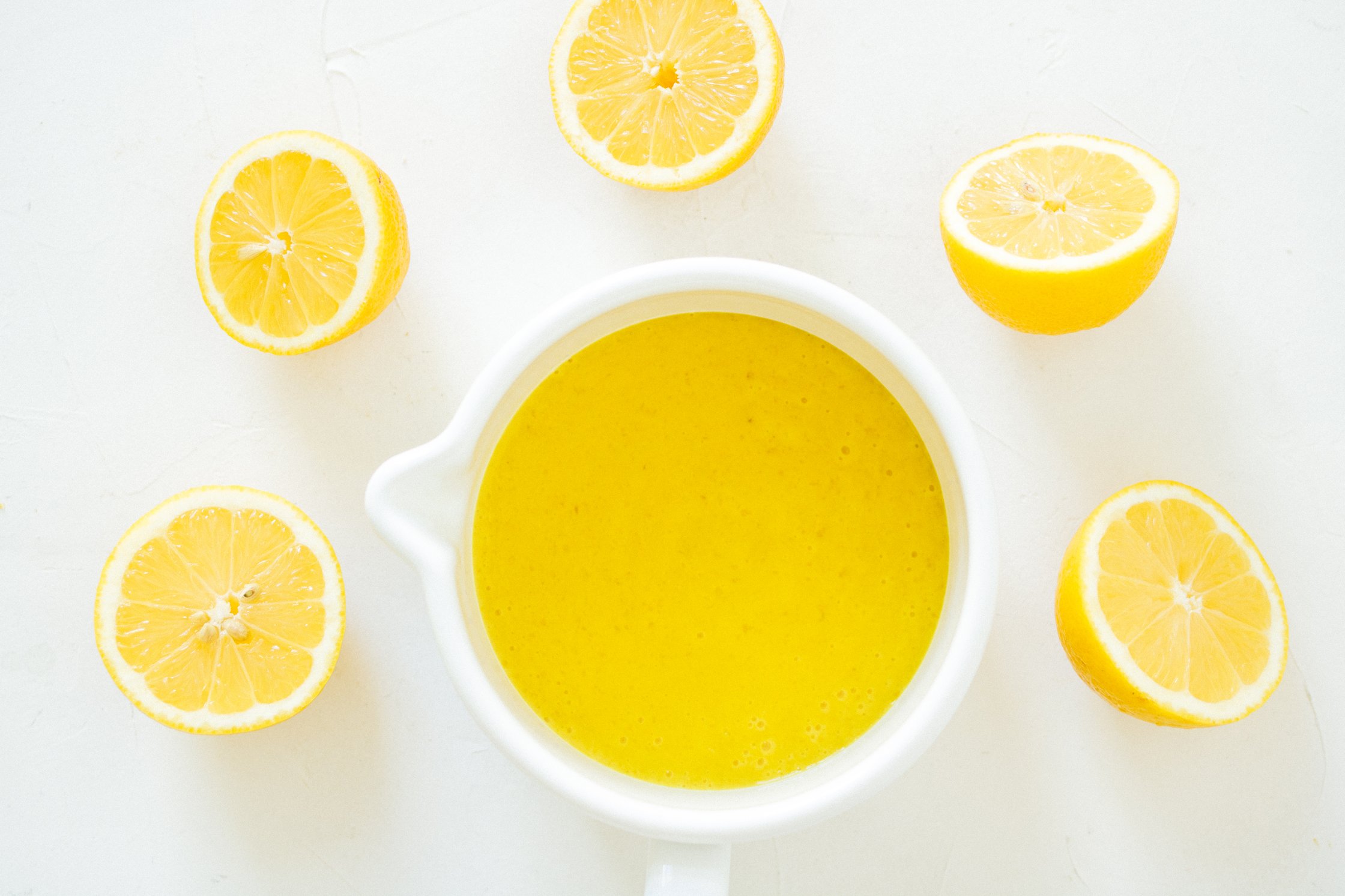 lemon curd with fresh lemons around