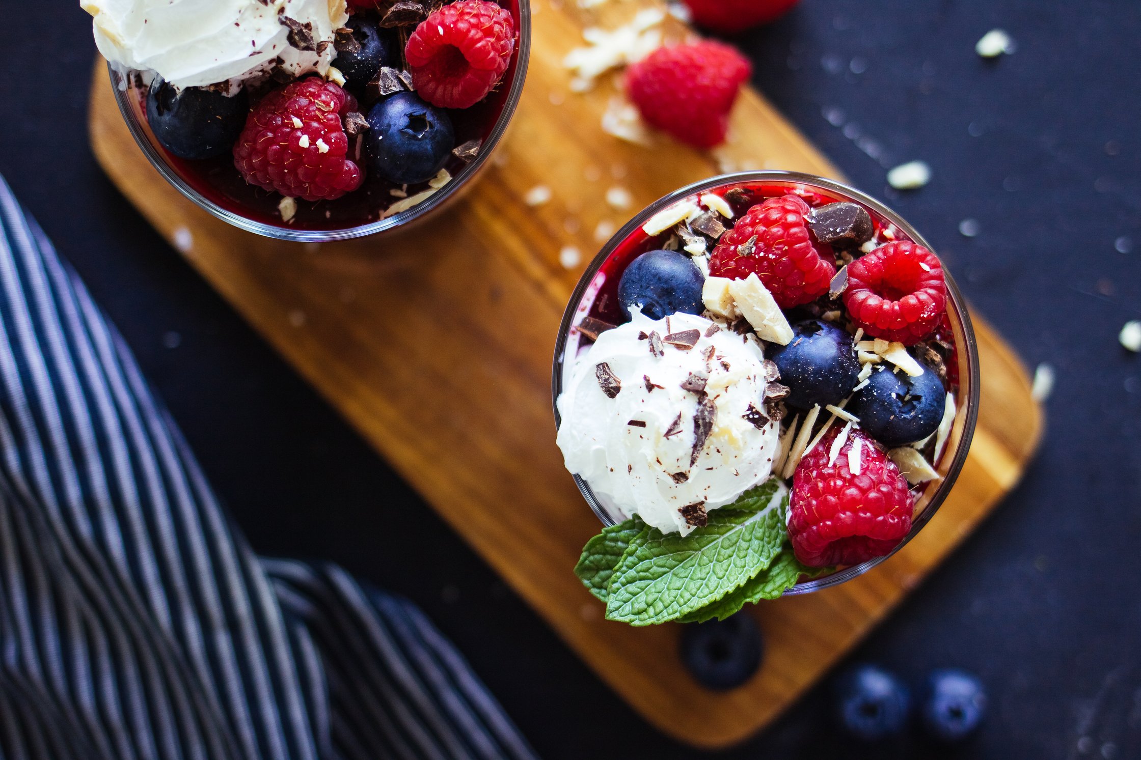 vegan chocolate mousse with berries and whipped cream