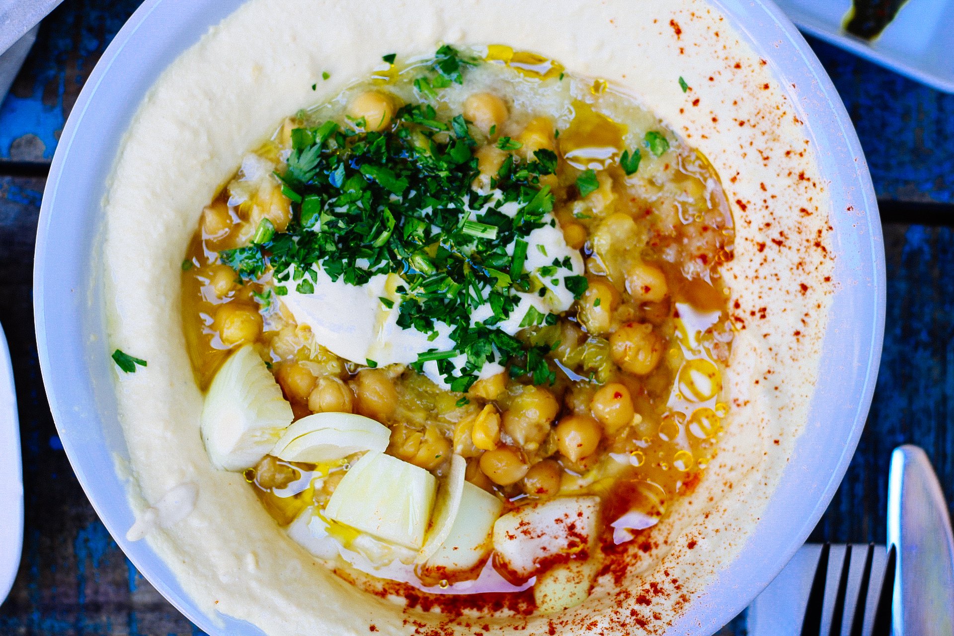 a plate filled with humus and chickpeas