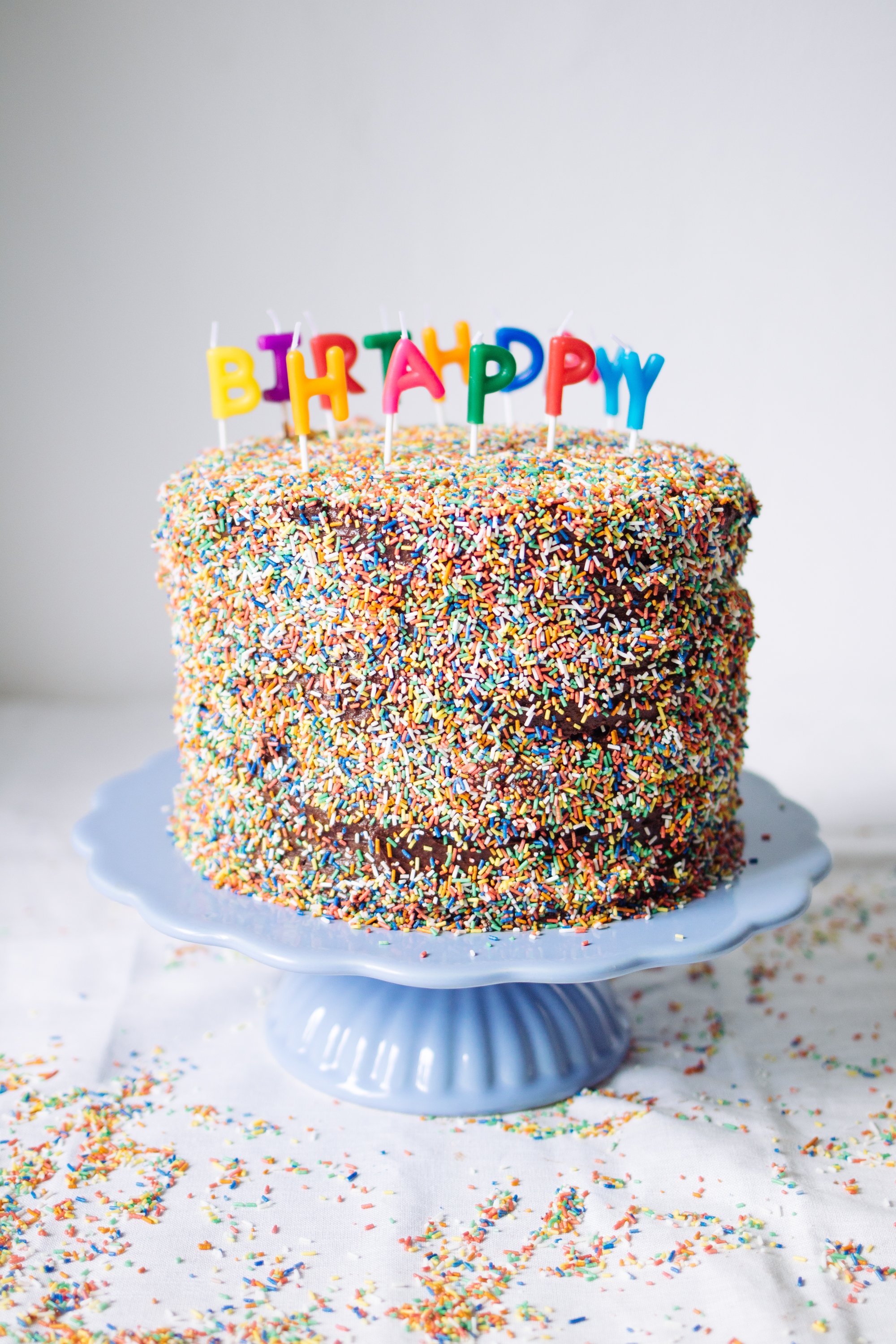 the cake is decorated with a lot of sprinkles