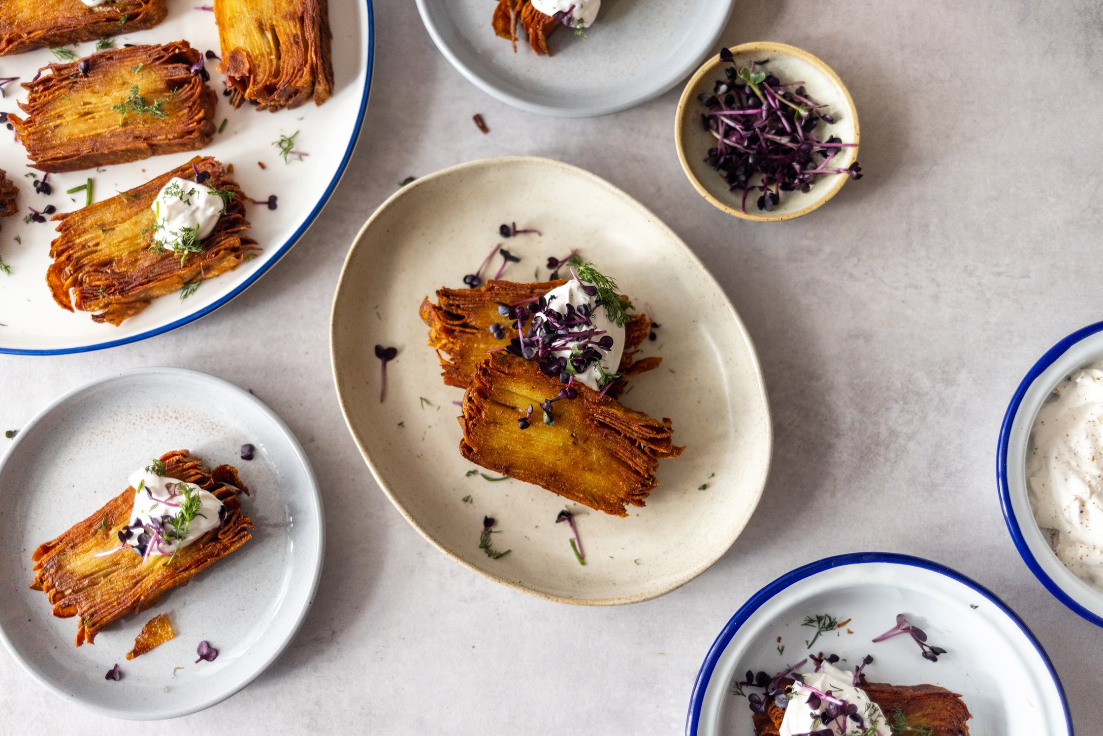 small plates of Crispy Vegan Thousand Layer Potatoes