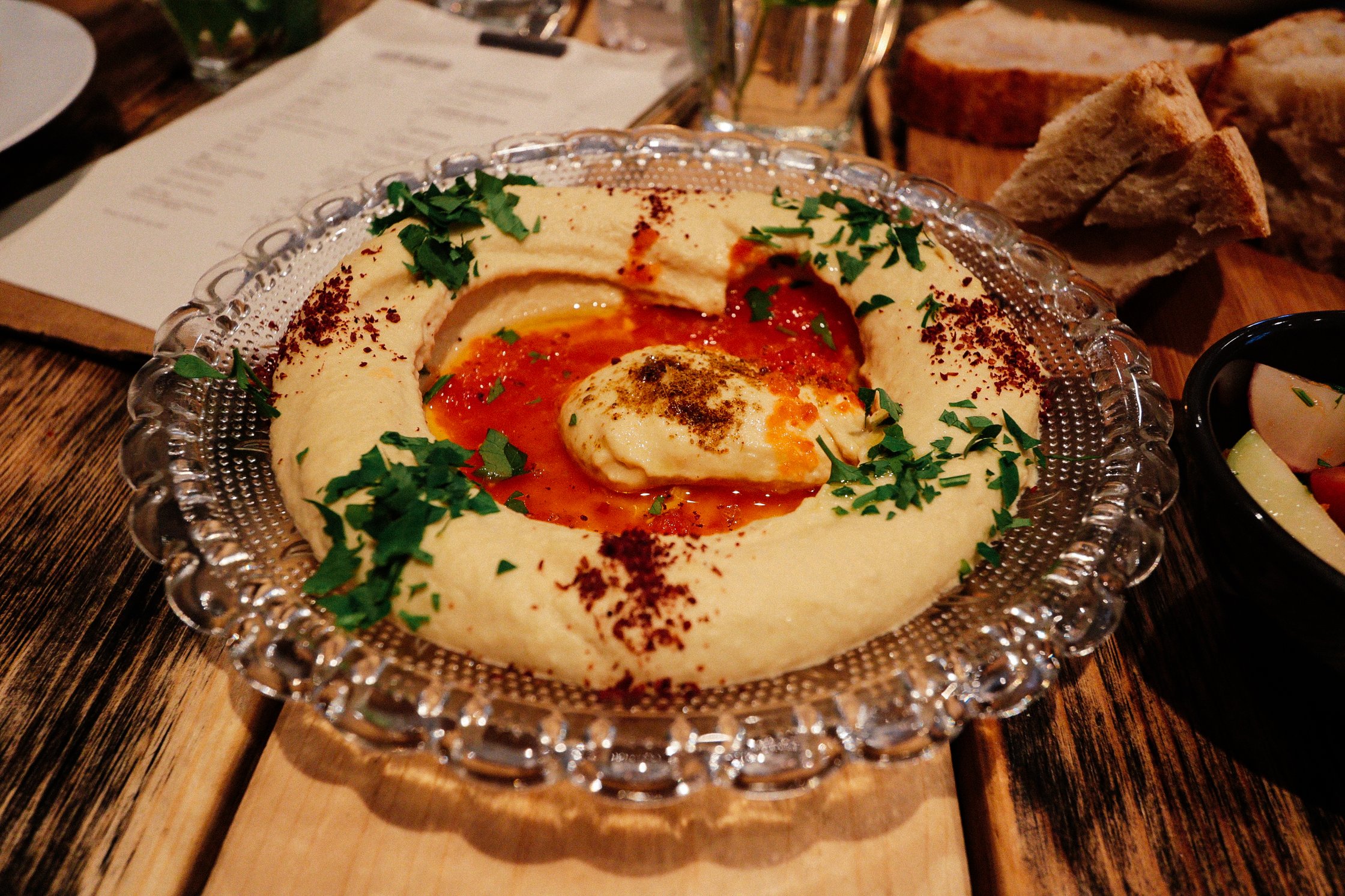 a big plate with hummus