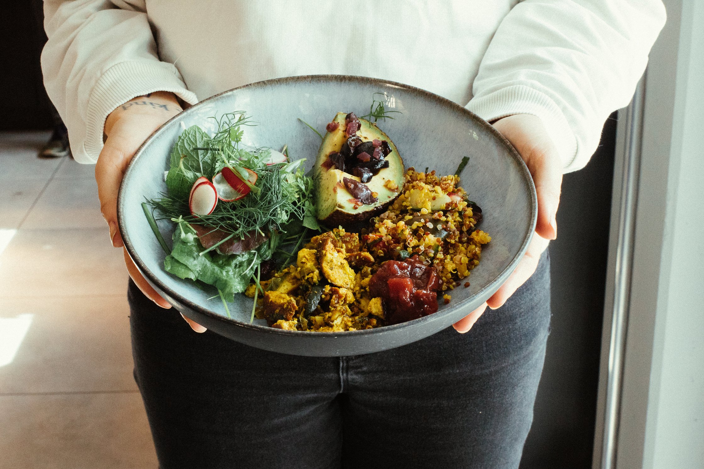 a bowl with salad and avocado