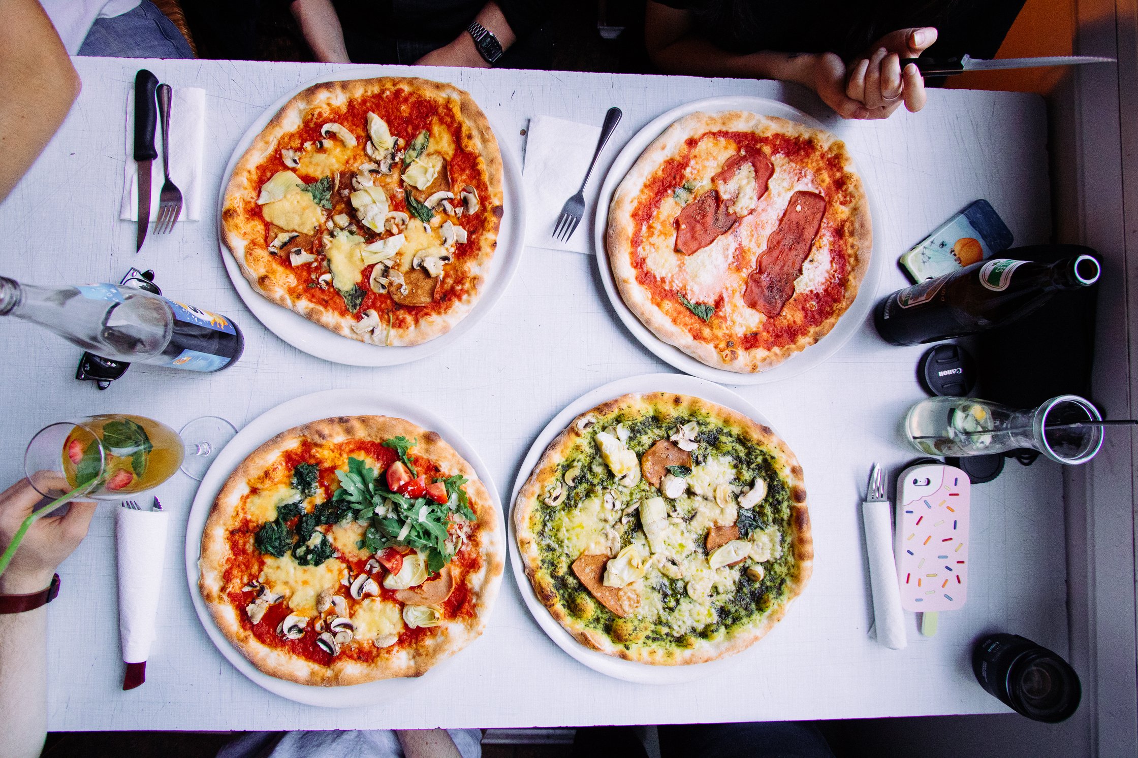 four pizzas on a plate