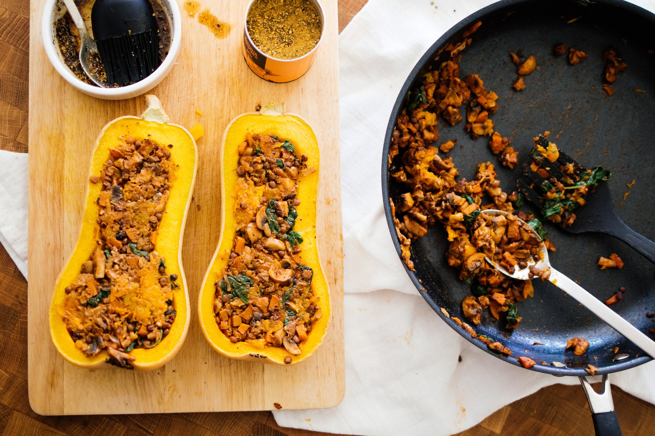 filling the butternut squash with veggies