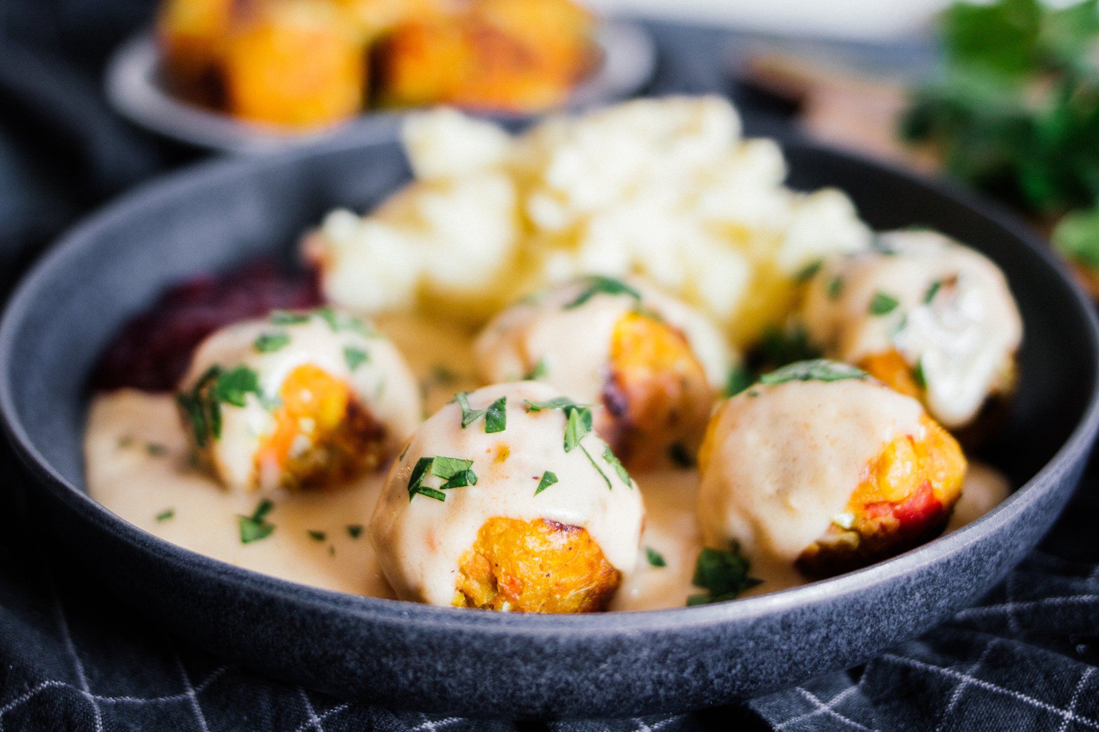 vegan Swedish meatballs with creme sauce on a plate