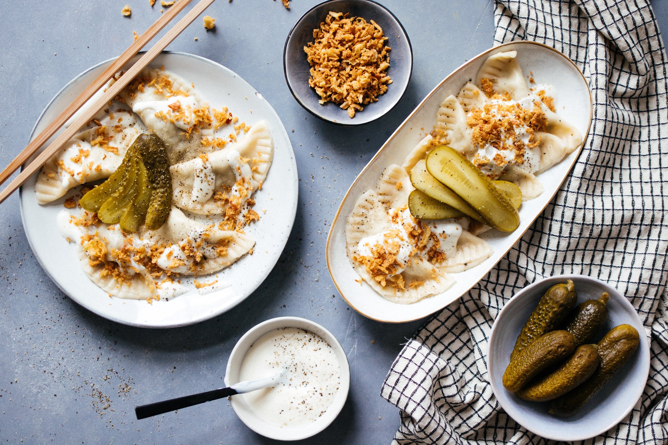 two plates with vegan pierogis