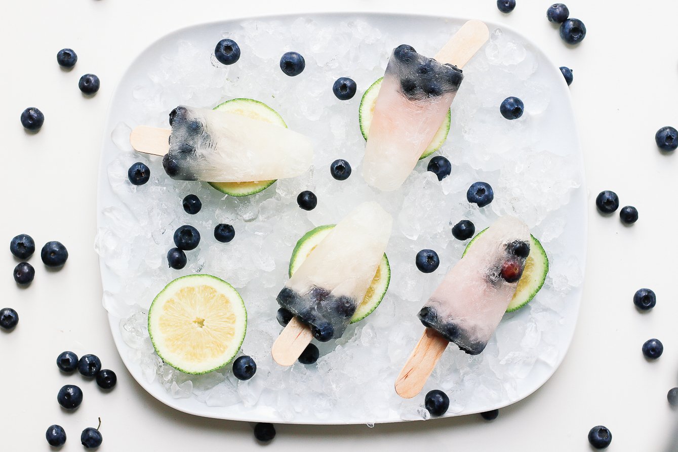 Popsicles on a plate blueberries around