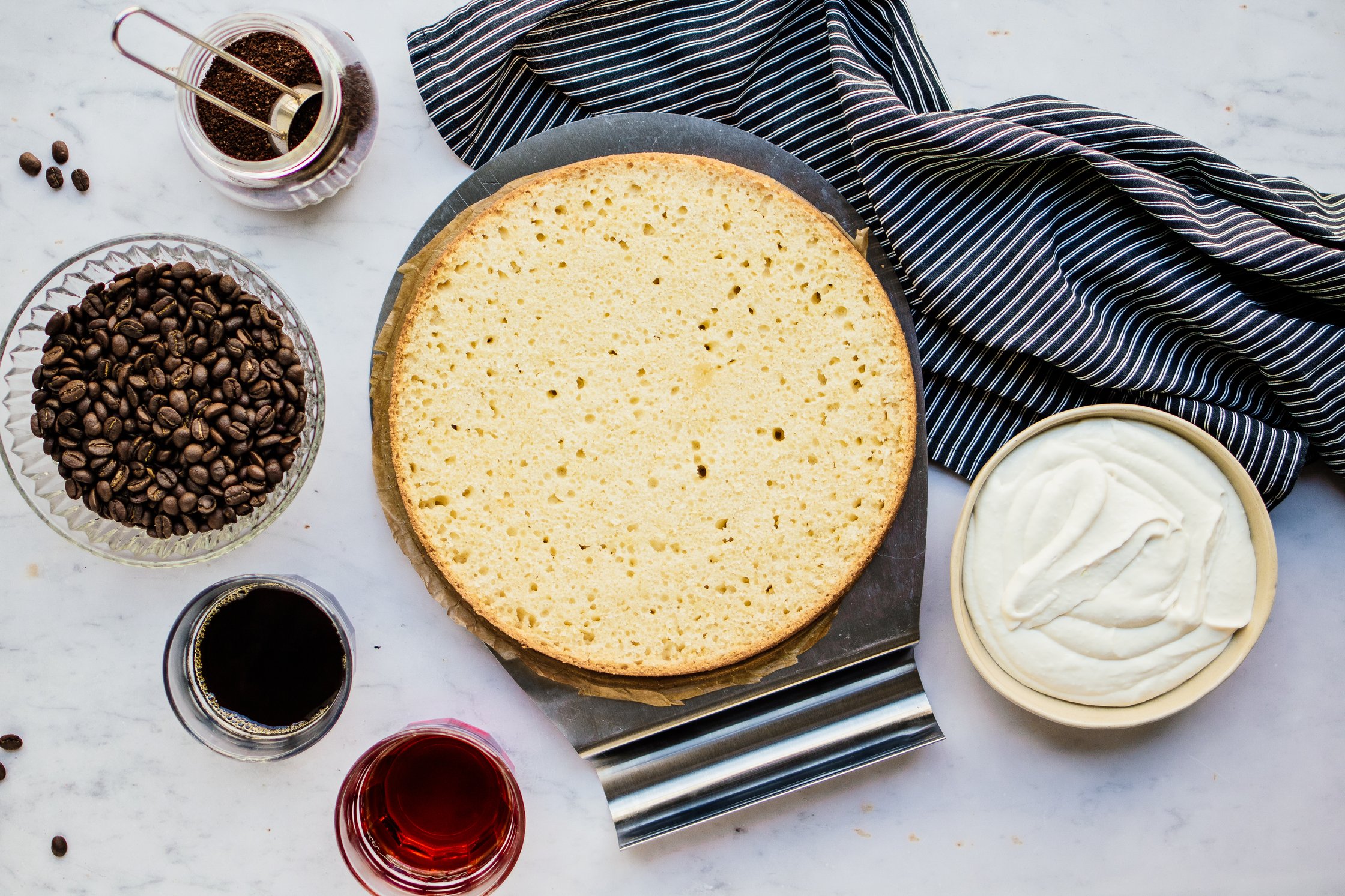 Sponge Cake, Coffee Beans, a Glas with Coffee, Cream