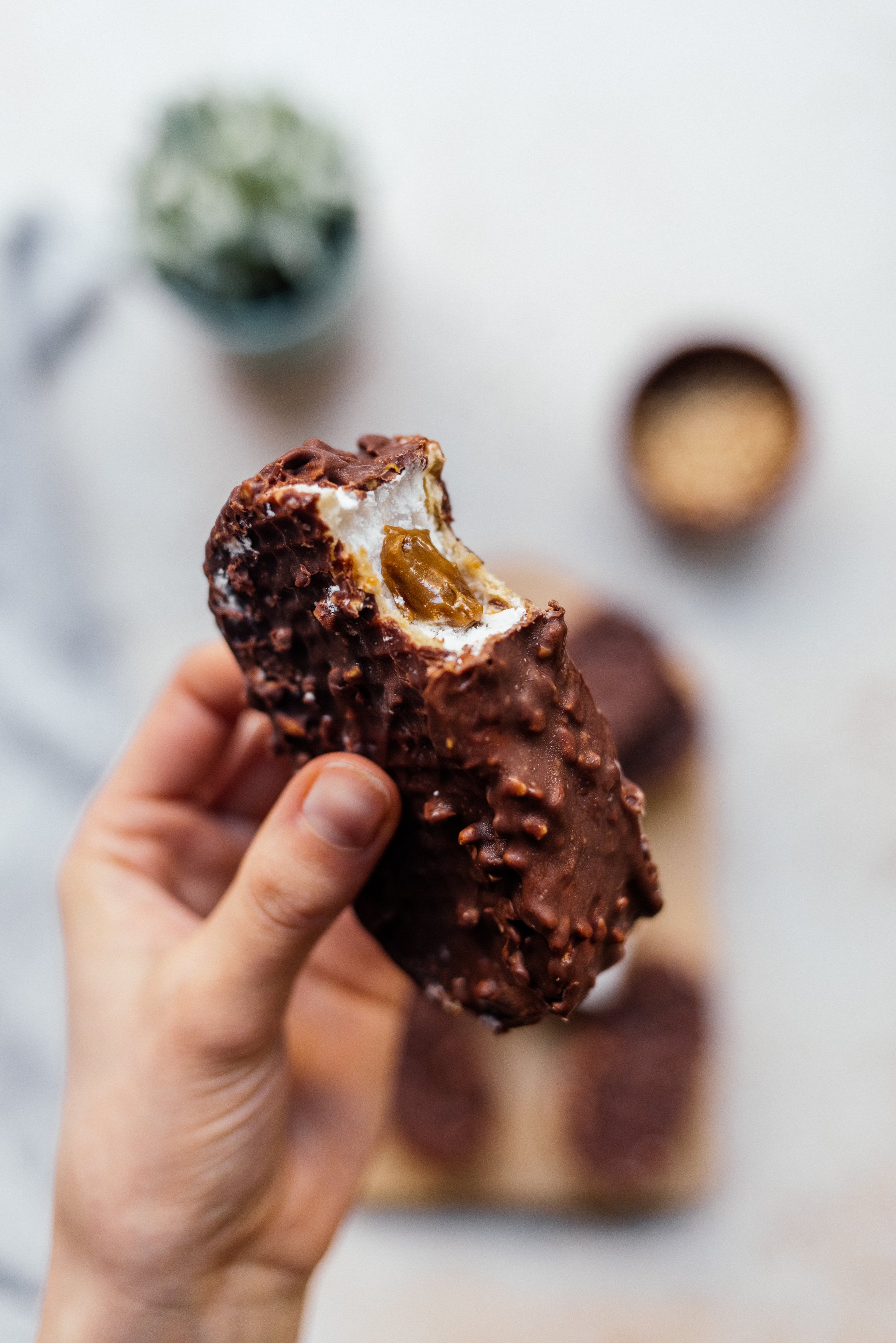 vegan icebox milk chocolate bar with caramel core cut open