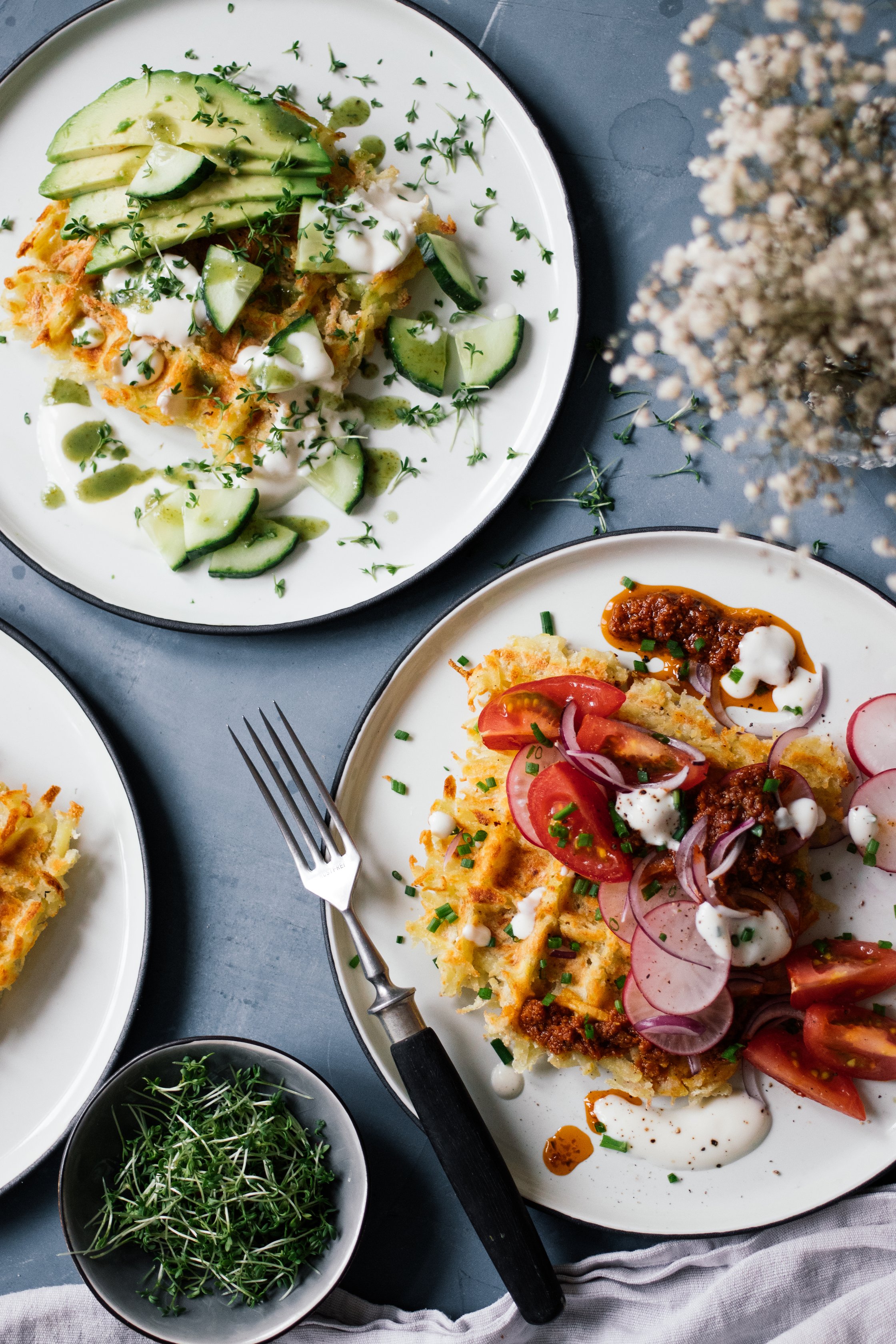 savory potato waffles with toppings on a table