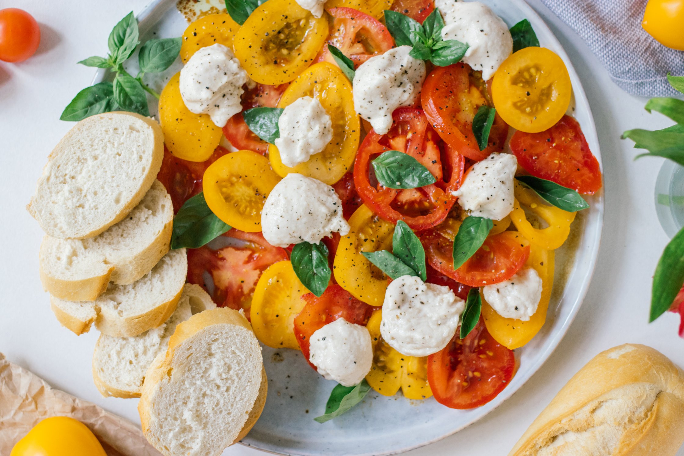 vegan caprese salad served with bread